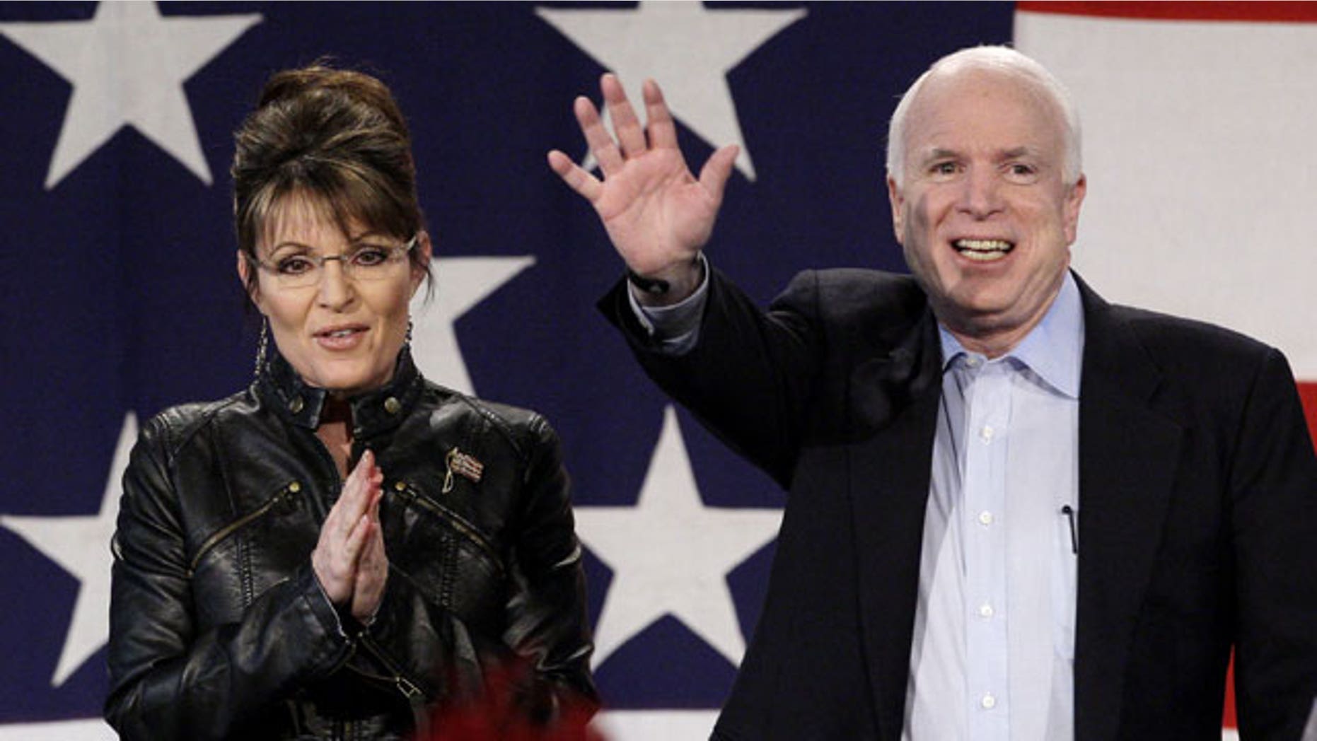 March 26: Sen. John McCain, R-Ariz., is joined on stage by Sarah Palin as she makes an appearance with him at a rally at the Pima County Fairgrounds in Tucson, Ariz.