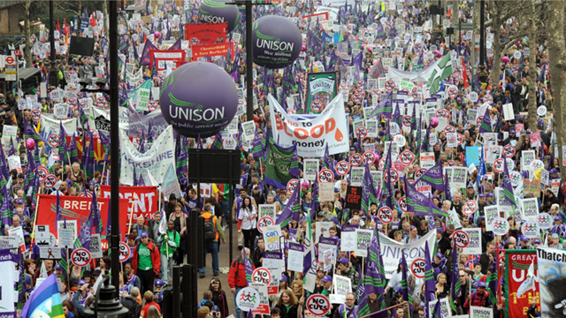 March 26: Demonstrators begin their march in London to protest against government spending cuts.