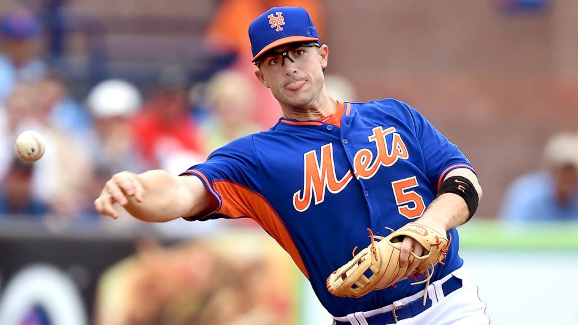 Mar 24, 2014; Port St. Lucie, FL, USA;New York Mets third baseman David Wright (5) makes a play against the St. Louis Cardinals in spring training action at Tradition Stadium. Mandatory Credit: Brad Barr-USA TODAY Sports