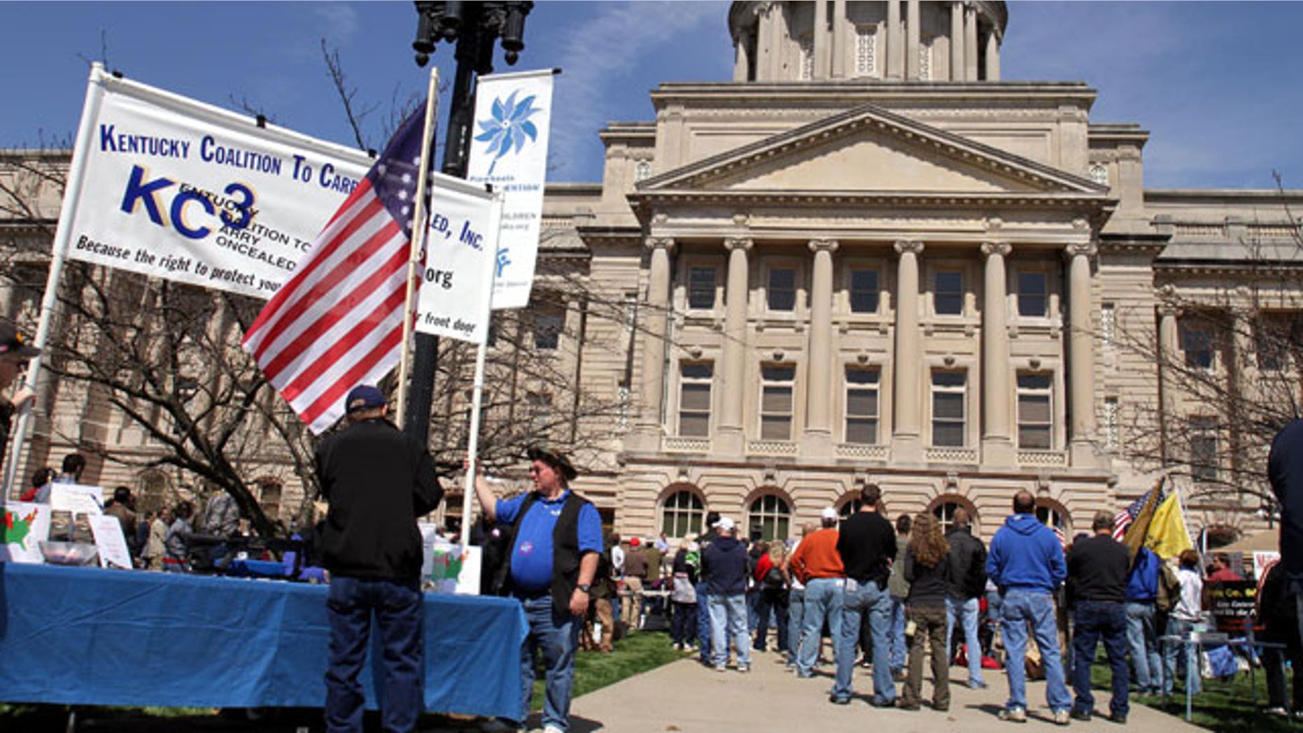 March 27: People listen to speakers near the Kentucky State Capitol in Frankfort, Ky., during a second amendment rally.