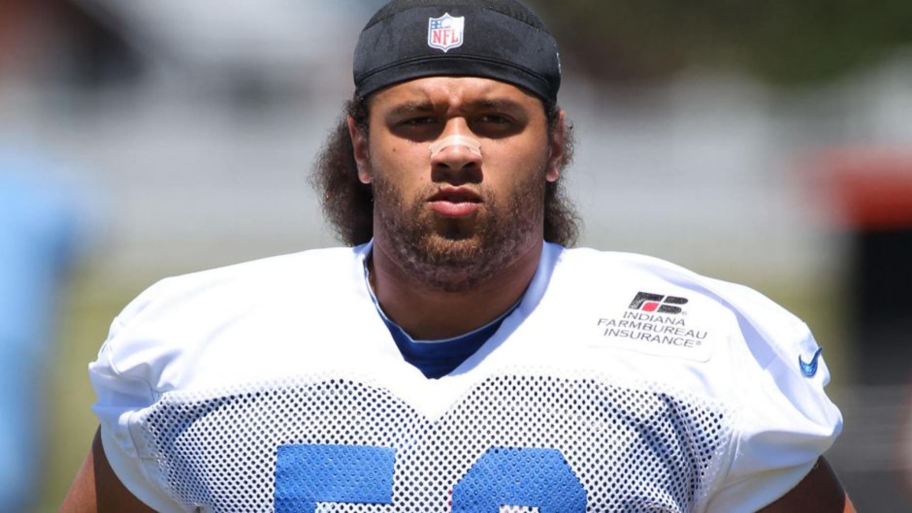Jul 29, 2013; Anderson, IN, USA; Indianapolis Colts offensive guard Khaled Holmes (56) runs on the field during the Indianapolis Colts training camp at Anderson University. Mandatory Credit: Brian Spurlock-USA TODAY Sports