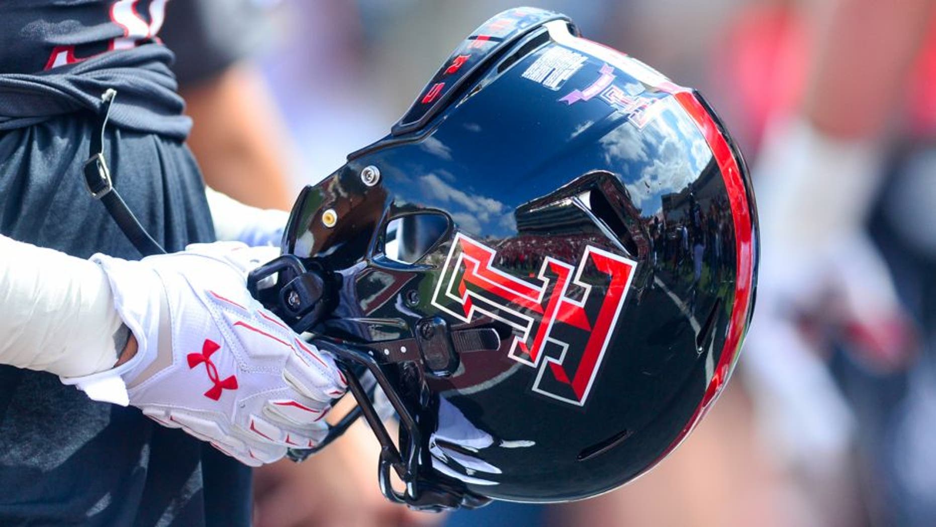 LUBBOCK, TX - OCTOBER 10: A Texas Tech Red Raider player holds a helmet before the game against the Iowa State Cyclones on October 10, 2015 at Jones AT&T Stadium in Lubbock, Texas. Texas Tech won the game 66-31. (Photo by John Weast/Getty Images)