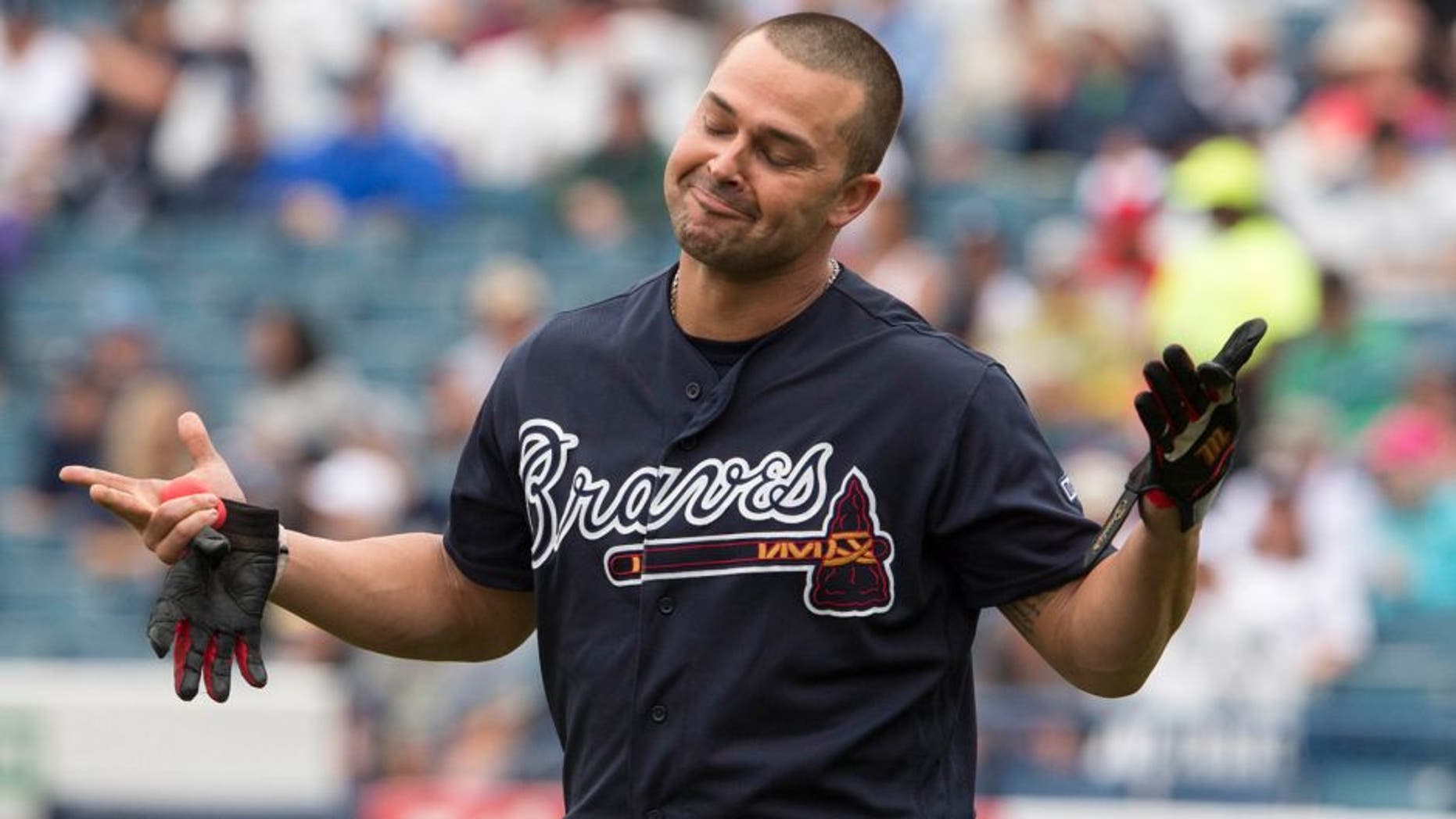 Mar 19, 2016; Tampa, FL, USA; Atlanta Braves first baseman Nick Swisher (23) reacts to the catch made by New York Yankees center fielder Jacoby Ellsbury (not pictured) during the first inning at George M. Steinbrenner Field. Mandatory Credit: Jerome Miron-USA TODAY Sports