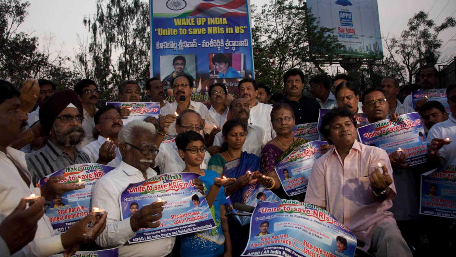 Parents of Indians living abroad are joined by others to participate in a candlelight vigil to pay their tributes to Srinivas Kuchibhotla in Hyderabad, India, Thursday, March 9, 2017.