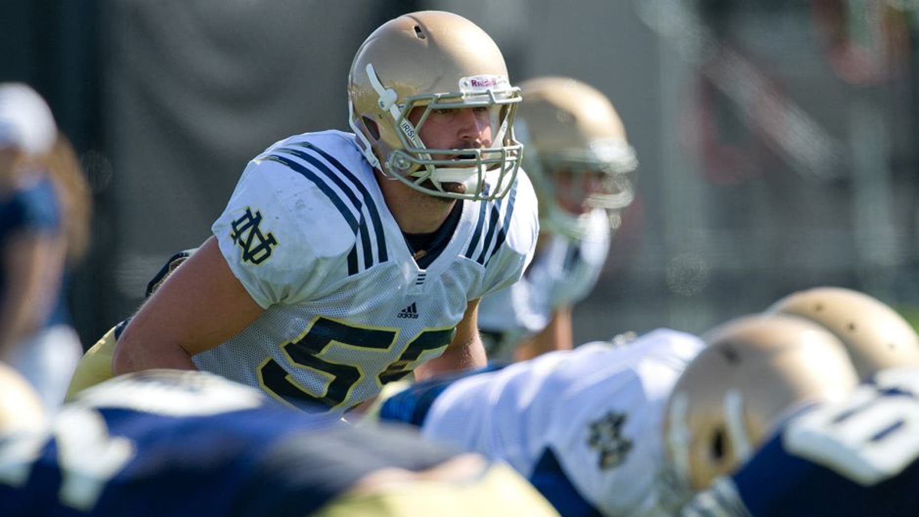 Aug 9, 2013; South Bend, IN, USA; Notre Dame Fighting Irish linebacker Jarrett Grace (59) readies for the snap during practice at the LaBar Practice Complex. Mandatory Credit: Matt Cashore-USA TODAY Sports