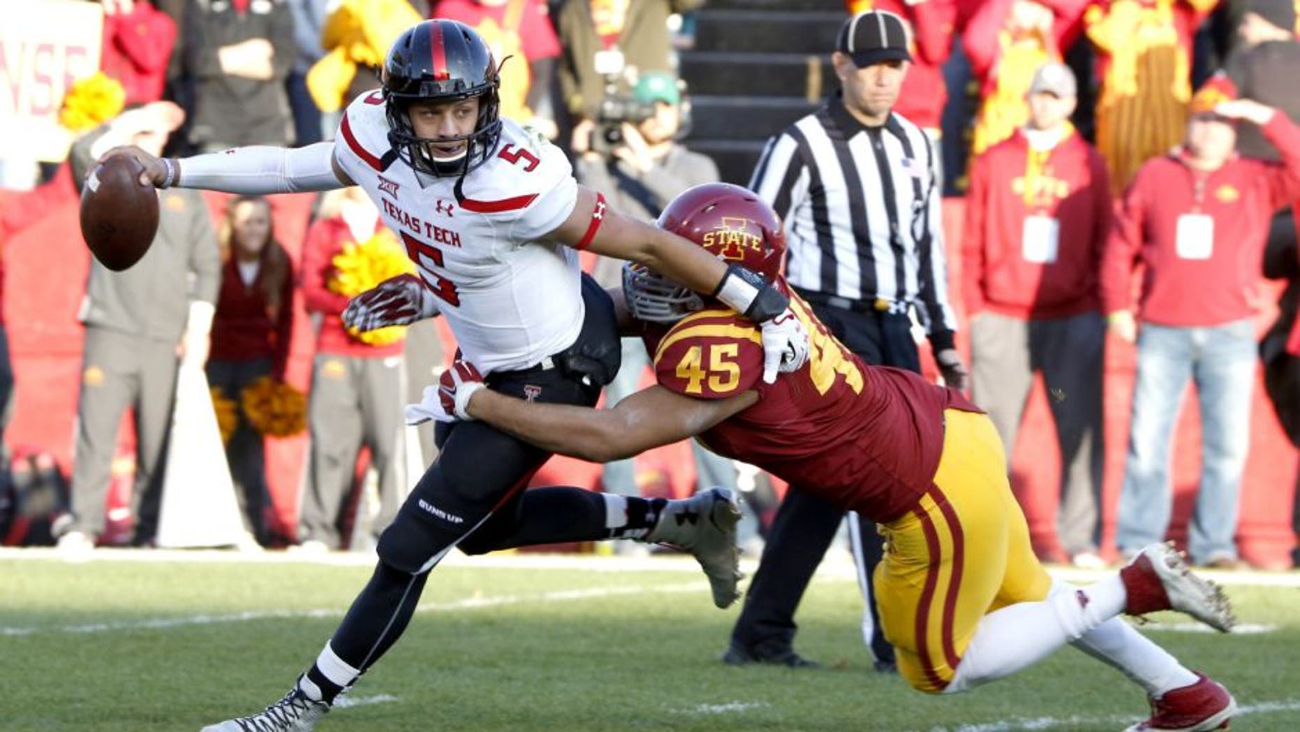 AMES, IA - NOVEMBER 22: Quarterback Patrick Mahomes #5 of the Texas Tech Red Raiders is tackled by defensive end Dale Pierson #45 of the Iowa State Cyclones in the first half of play at Jack Trice Stadium on November 22, 2014 in Ames, Iowa. (Photo by David K Purdy/Getty Images)