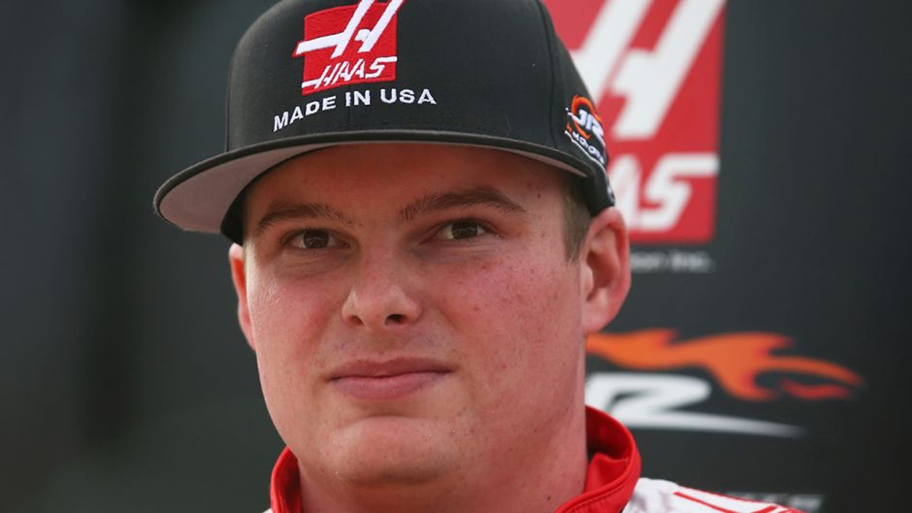 DAYTONA BEACH, FL - FEBRUARY 19: Cole Custer, driver of the #00 Haas Automation Chevrolet, stands on the grid during qualifying for the NASCAR Camping World Truck Series NextEra Energy Resources 250 at Daytona International Speedway on February 19, 2016 in Daytona Beach, Florida. (Photo by Sarah Crabill/NASCAR via Getty Images)