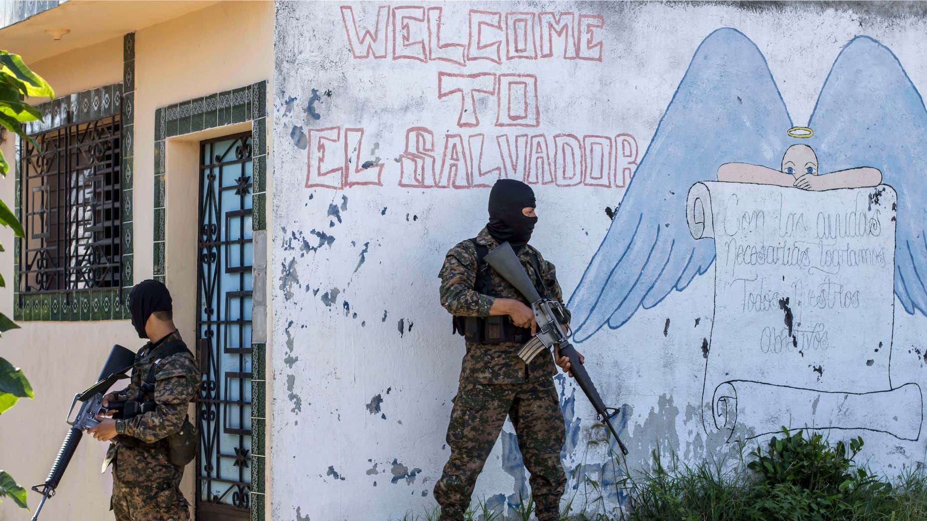 FILE - In this Aug. 31, 2015 file photo, soldiers guard a corner in a gang-controlled neighborhood in Ilopango, El Salvador.