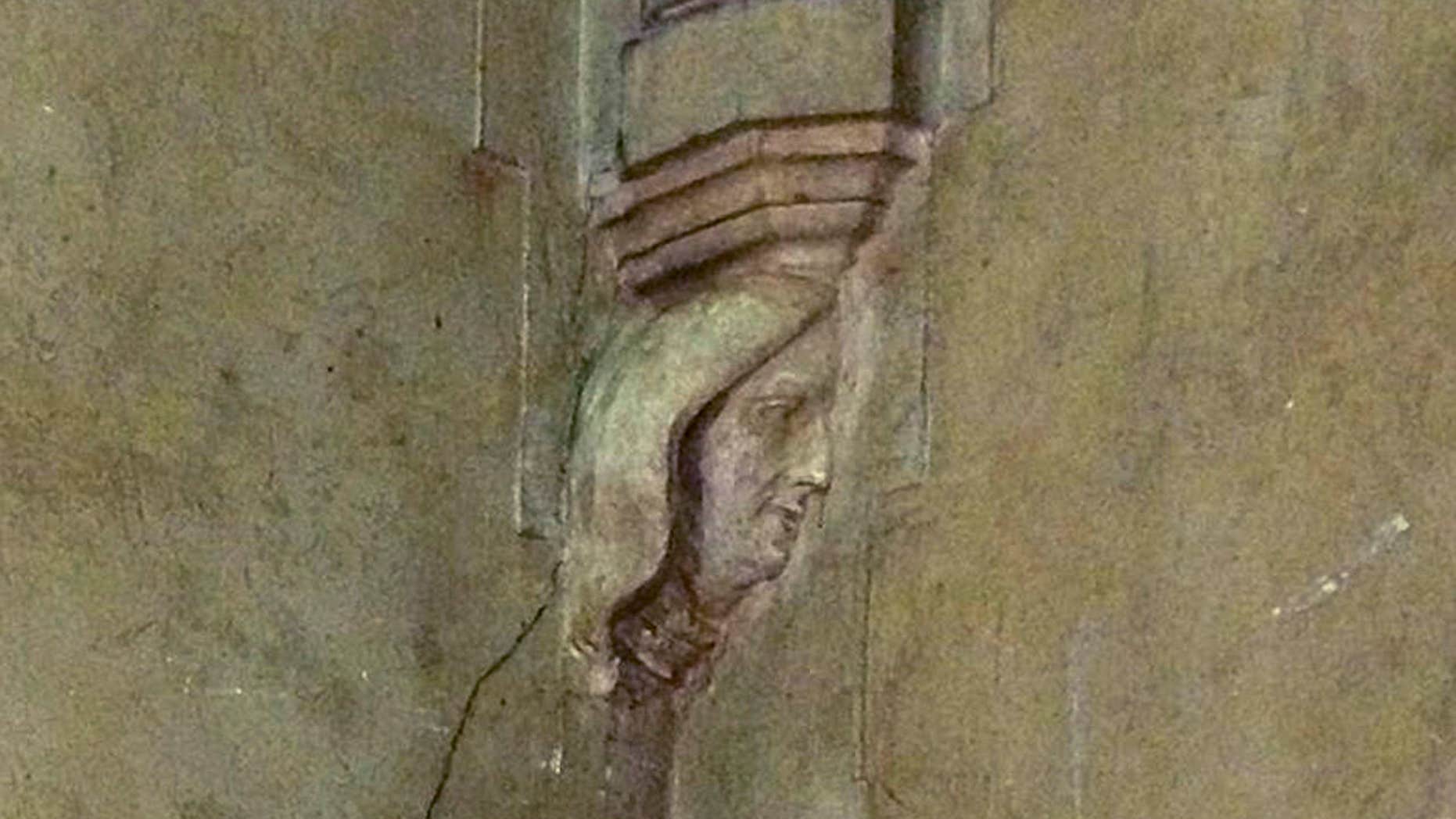 In this undated photo provided by St. Mary's Church, the carved figure of a woman's face is visible on a wall in the church in Newport, R.I.