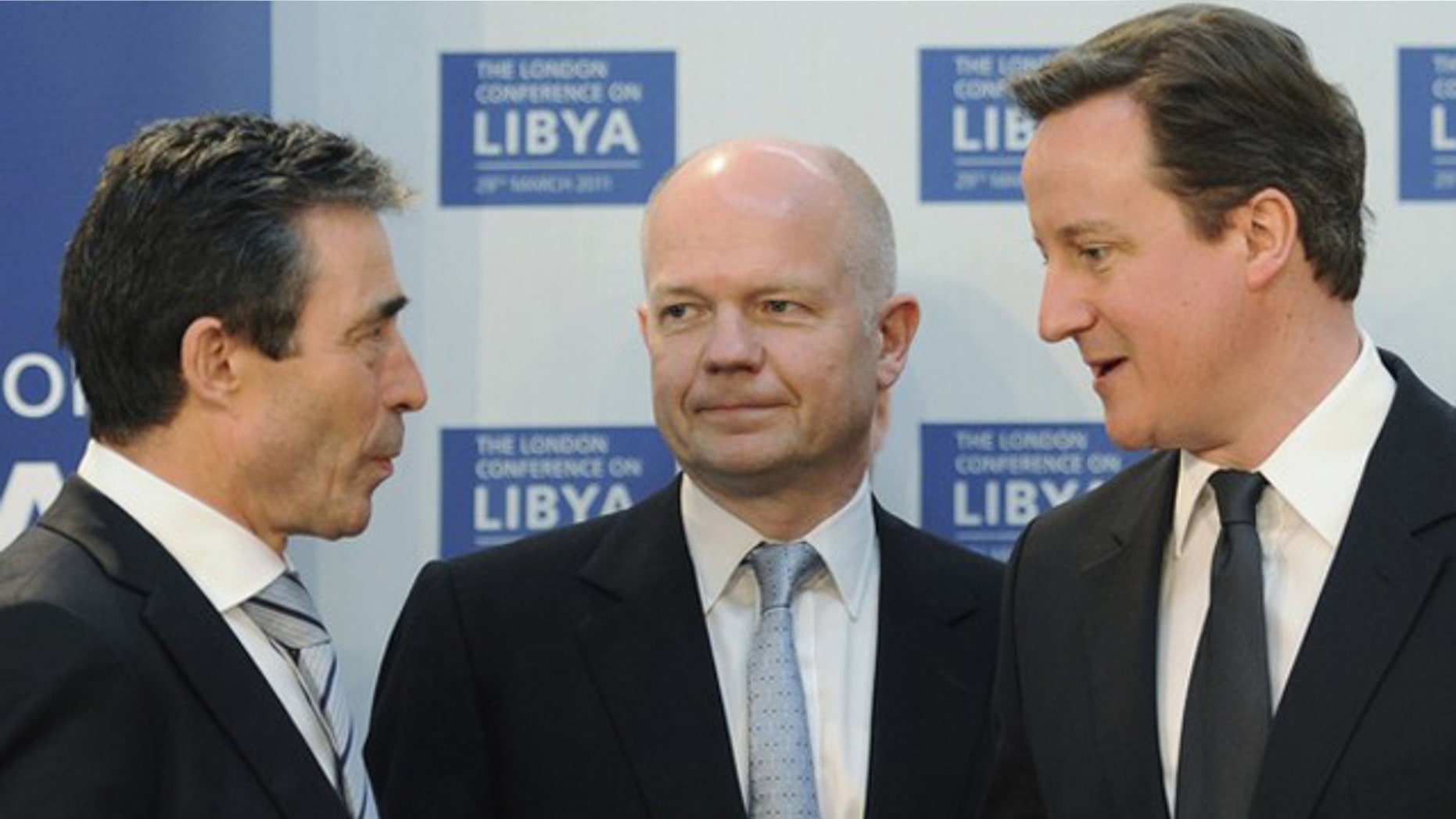 March 29: Britain's Prime Minister David Cameron (R) speaks to NATO Secretary General Anders Fogh Rasmussen (L), watched by Foreign Secretary William Hague, at the Foreign & Commonwealth Office in London.