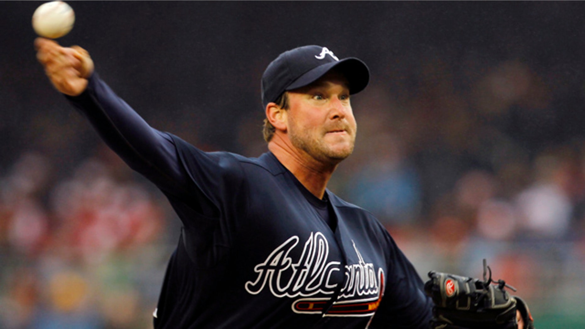March 31: Atlanta Braves pitcher Derek Lowe throws the ball in the second inning of their opening day baseball game with the Washington Nationals in Washington.