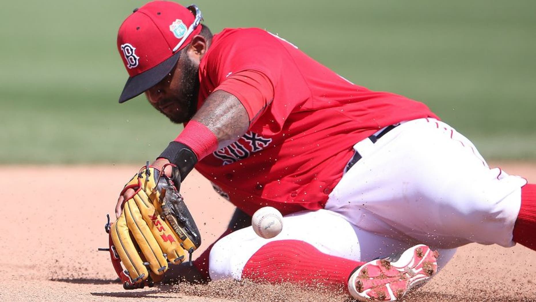FORT MYERS, - MARCH 14: Pablo Sandoval #48 of the Boston Red Sox knocks the ball down at third base on the ground ball from Jason Rogers (not in photo) of the Pittsburgh Pirates an makes the play to first base for the out during the fourth inning of the Spring Training Game on March 14, 2016 at Jet Blue Park at Fenway South, Florida. The Pirates defeated the Red Sox 3-1. (Photo by Leon Halip/Getty Images)