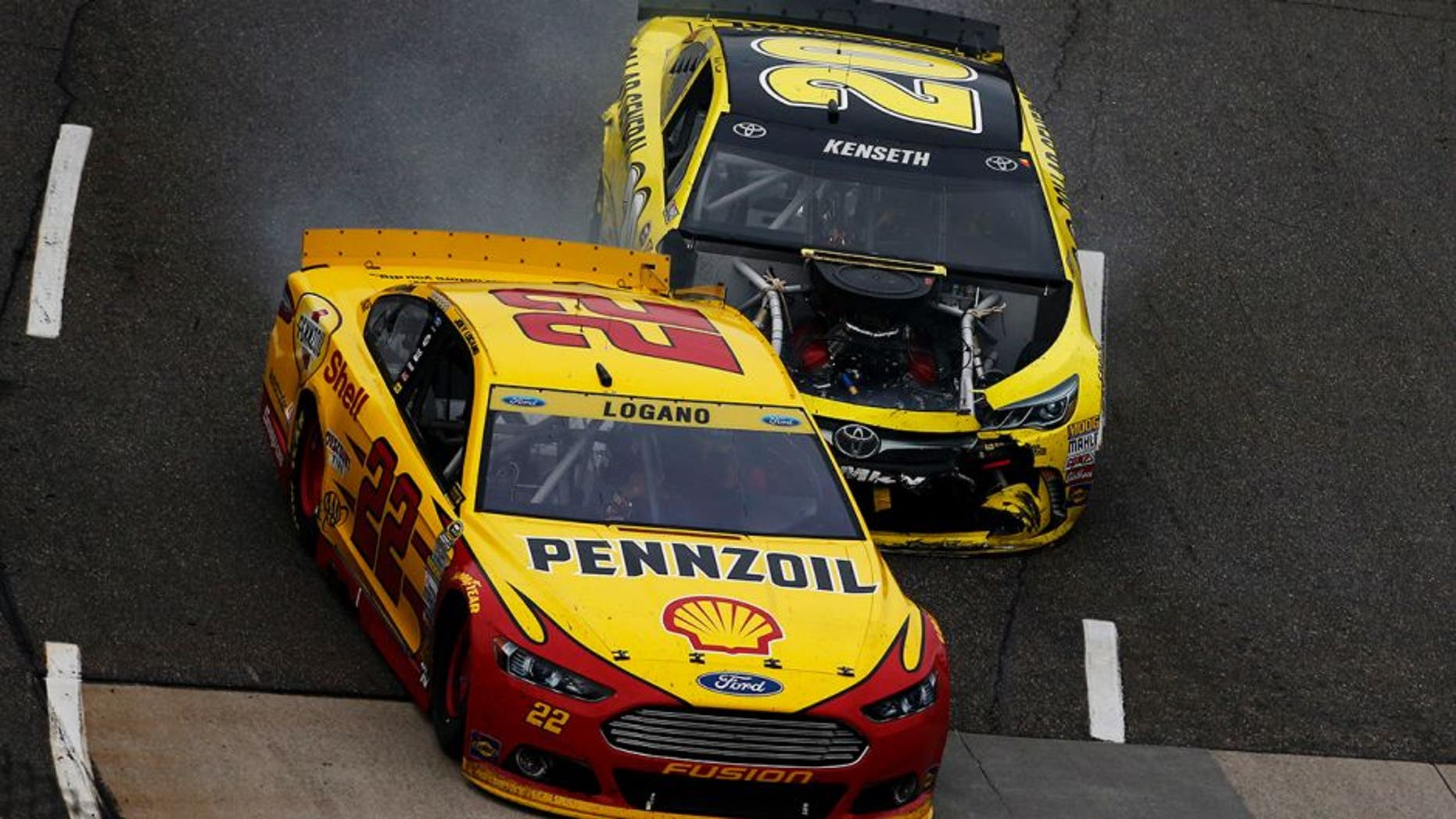 MARTINSVILLE, VA - NOVEMBER 01: Matt Kenseth, driver of the #20 Dollar General Toyota, makes contact with Joey Logano, driver of the #22 Shell Pennzoil Ford, during the NASCAR Sprint Cup Series Goody's Headache Relief Shot 500 at Martinsville Speedway on November 1, 2015 in Martinsville, Virginia. (Photo by Jeff Zelevansky/Getty Images)
