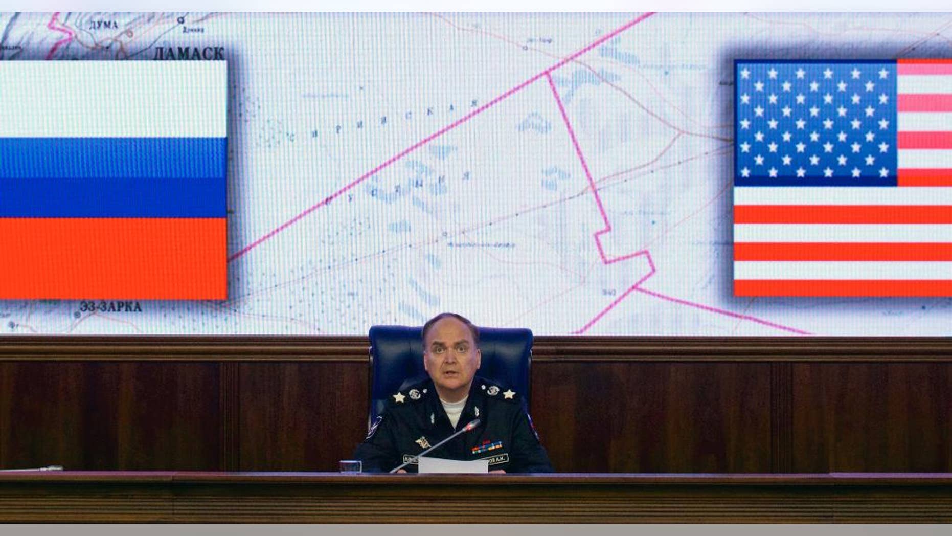 FILE - In this file photo dated Friday, Oct. 7, 2016, Russian Deputy Defense Minister Anatoly Antonov speaks during a media briefing in the Defense Ministry in Moscow. While Western media are filled with grim images of life in areas of Aleppo under siege by Russian-backed Syrian government forces, Russian news reports tell a very different story. (AP Photo/Ivan Sekretarev, File)