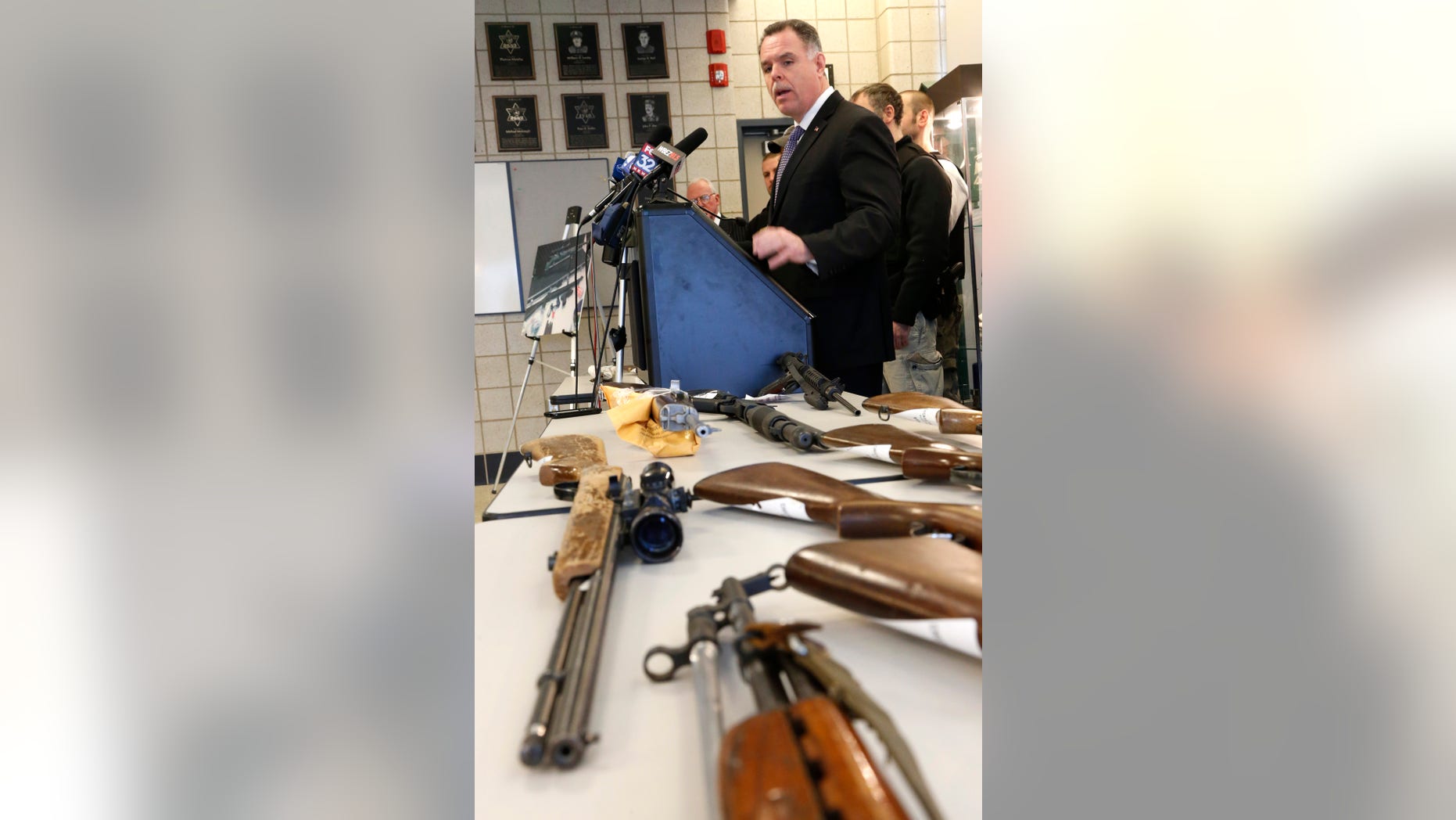 Chicago Police Superintendent Garry McCarthy stands near guns confiscated in Chicago and talks about the department's efforts to curb gun violence during a news conference Monday, Feb. 4, 2013, in Chicago. Police say they are receiving many tips as they investigate last week's shooting death of a 15-year-old Hadiya Pendleton. But there is also a concern that people with valuable information may not be coming forward and others wonder if people are staying silent out of concern that talking might put their own lives in danger. (AP Photo/Charles Rex Arbogast)