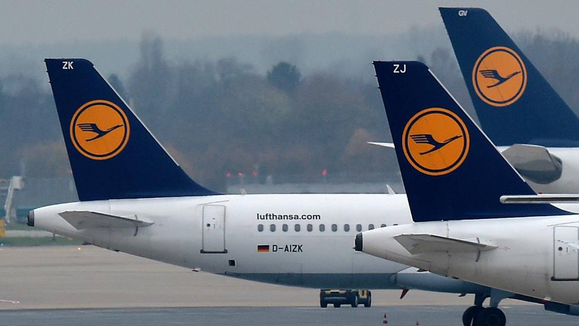 FILE - In this Dec. 1, 2014 file photo Lufthansa planes are parked at the airport in Duesseldorf, Germany. Lufthansa and their pilots found an agreement over all their rate disputes. (AP Photo/Martin Meissner, File)