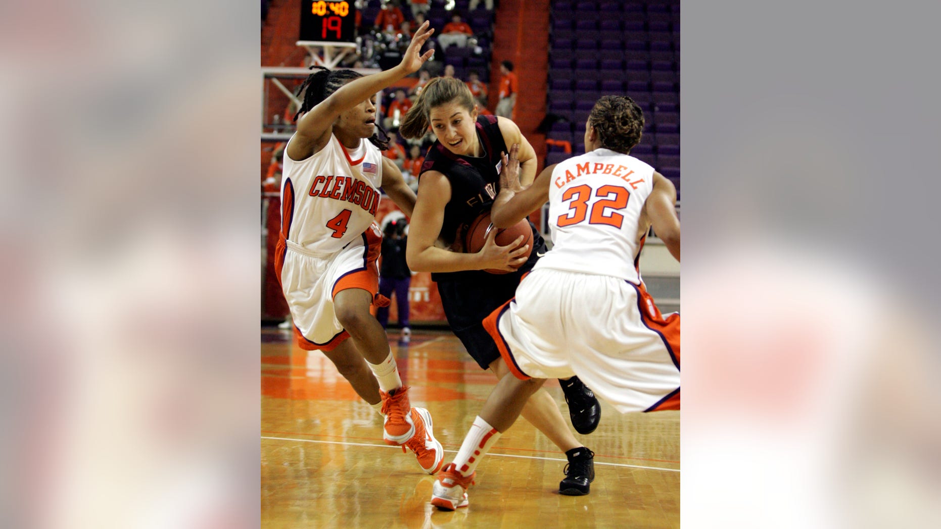 FILE- In this Jan. 14, 2010 file photo, Florida State's Leonor Rodriguez (10) gets fouled as she drives past Clemson's Christy Brown (4) and Morganne Campbell (32) during the first half of their women's NCAA college basketball game in Clemson, S.C. After an unremarkable first three seasons at a school far away from her home in Spain, the 21-year-old sharpshooter has become the driving force in the high-scoring Seminoles turnaround from its first loosing season in a decade. (AP Photo/Mary Ann Chastain, File)