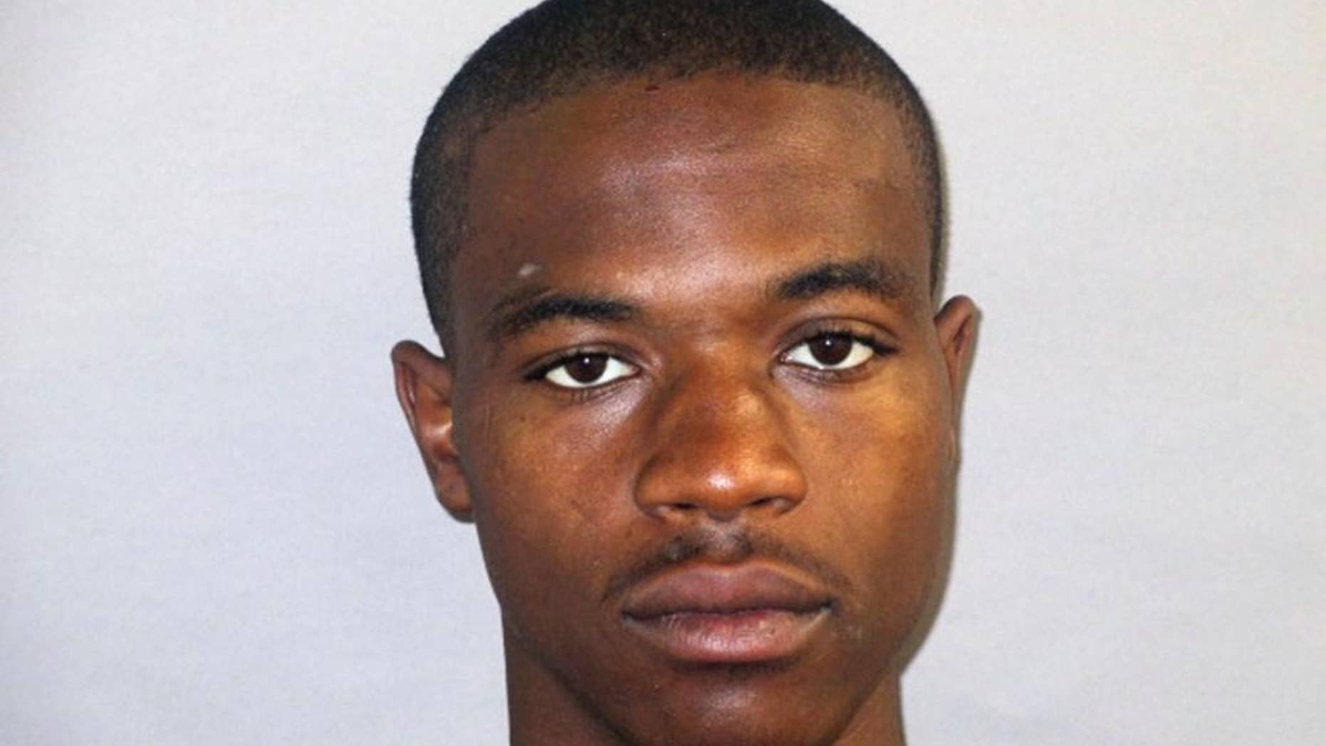 FILE - This July 2013 booking file photo provided by the Michigan Dept. of Corrections, shows Terrance Kellom. Kellom's mother has filed a wrongful death lawsuit against a U.S. customs agent who fatally shot her 20-year-old son. The complaint filed Thursday, April 6, 2017, in federal court in Detroit names Immigration and Customs Enforcement agent Mitchell Quinn and two Detroit police officers. Authorities were seeking Kellom on an arrest warrant in 2015 at his father's home. Police have said Quinn shot Kellom after Kellom lunged at the agent with a hammer. (Michigan Dept. Corrections via AP, File)