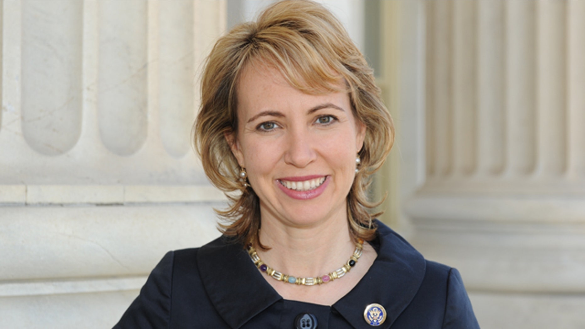 Rep. Gabrielle Giffords stood up in her hospital room Wednesday and looked out her window