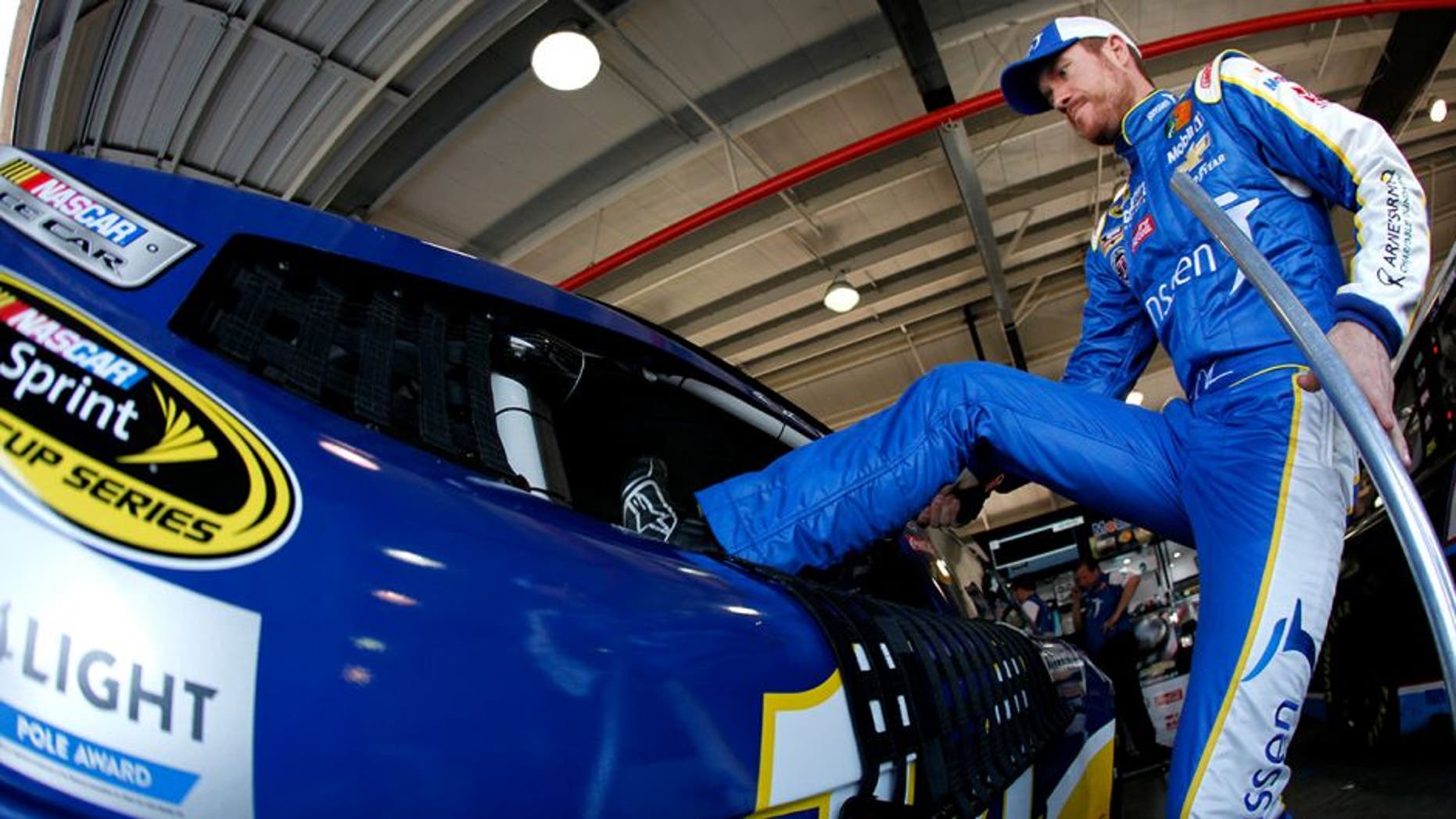 FONTANA, CA - MARCH 19: Brian Vickers, driver of the #14 Janssen Arnie's Army Charitable Foundation Chevrolet, gets into his car during practice for the NASCAR Sprint Cup Series Auto Club 400 at Auto Club Speedway on March 19, 2016 in Fontana, California. (Photo by Jonathan Ferrey/Getty Images)