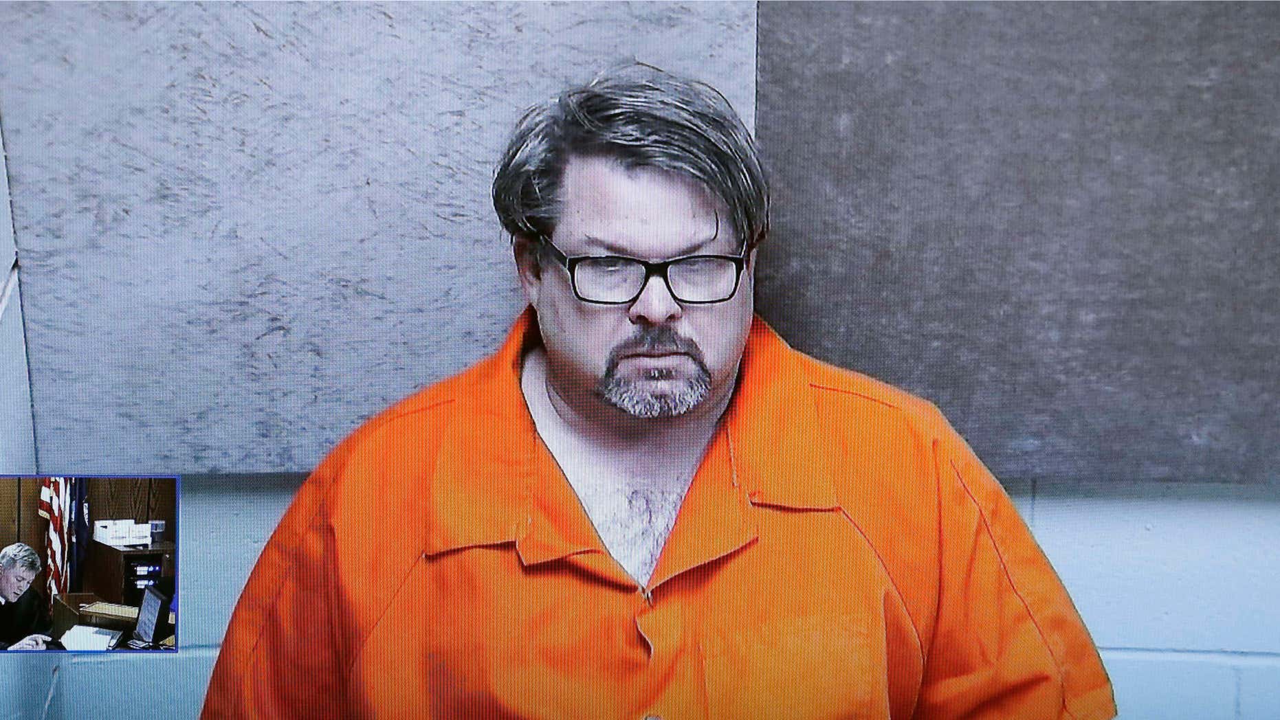 FILE - In this Feb. 22, 2016, file photo, Jason Dalton, of Kalamazoo Township, Mich., is arraigned via video before Judge Christopher T. Haenicke in Kalamazoo, Mich.