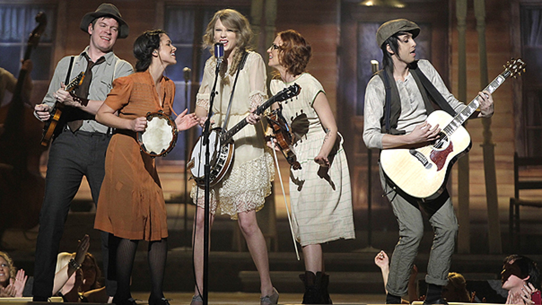 April 3: Taylor Swift, center, performs at the 46th Annual Academy of Country Music Awards in Las Vegas.