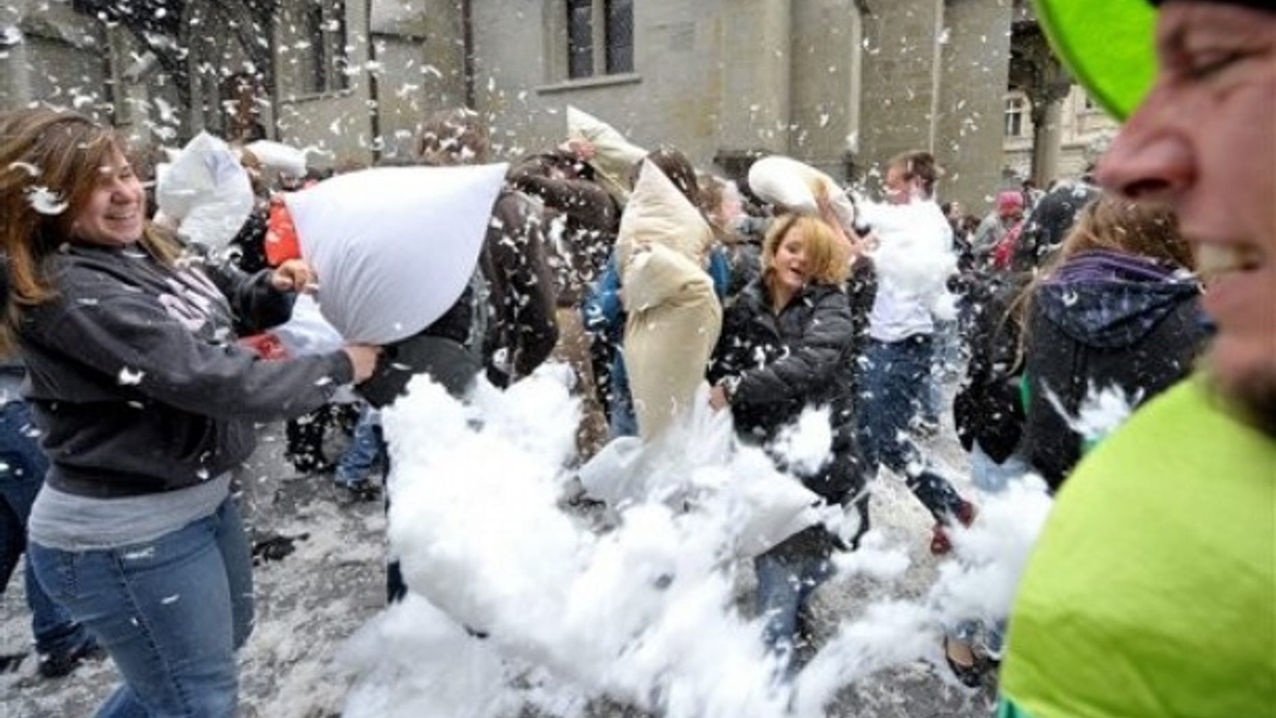 Young poeple take part in an organized pillow fight in Lausanne, Switzerland.