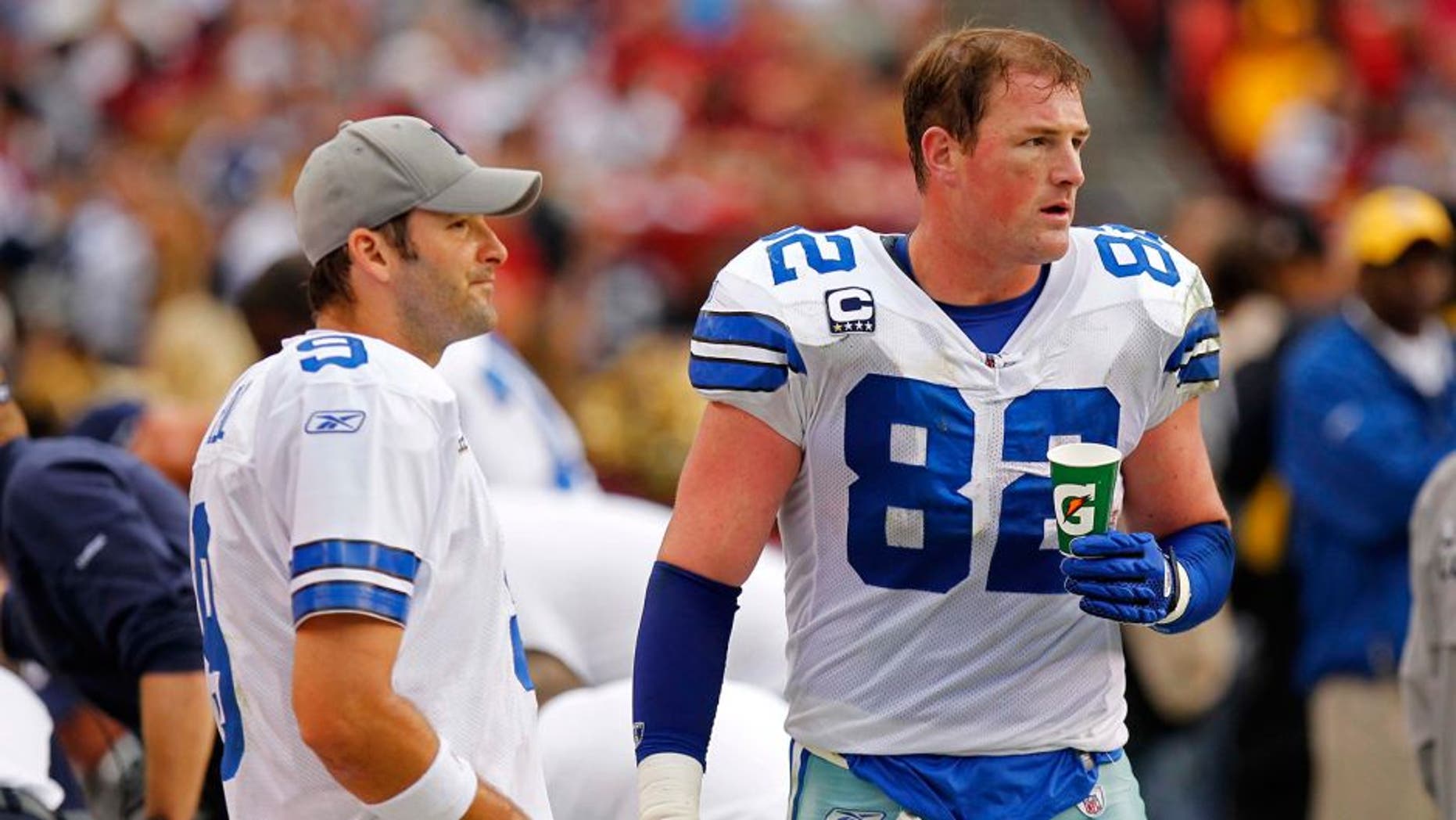 November 20, 2011; Landover, MD, USA; Dallas Cowboys quarterback Tony Romo (9) talks with Cowboys tight end Jason Witten (82) on the sidelines against the Washington Redskins at FedEx Field. Mandatory Credit: Geoff Burke-USA TODAY Sports