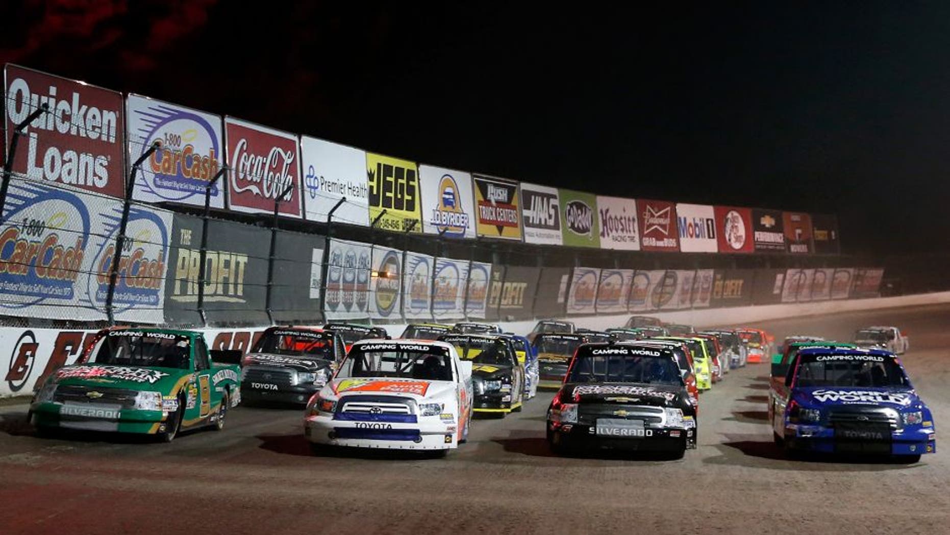 ROSSBURG, OH - JULY 24: Ken Schrader, driver of the #52 Federated Auto Parts Toyota, leads the field as they line up four wide during the NASCAR Camping World Truck Series inaugural CarCash Mudsummer Classic at Eldora Speedway on July 24, 2013 in Rossburg, Ohio. (Photo by Chris Graythen/NASCAR via Getty Images)