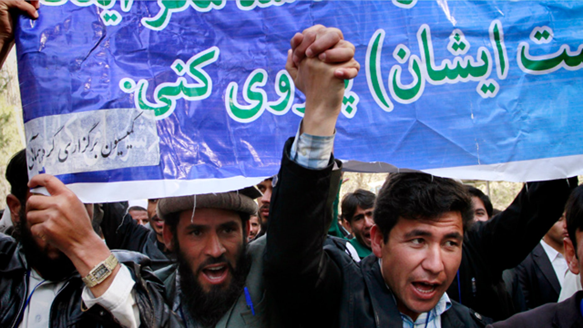 April 5: Afghan students shout anti-U.S. slogans during a demonstration to condemn the burning of a copy of the Muslim holy book by a Florida pastor in Kabul, Afghanistan.