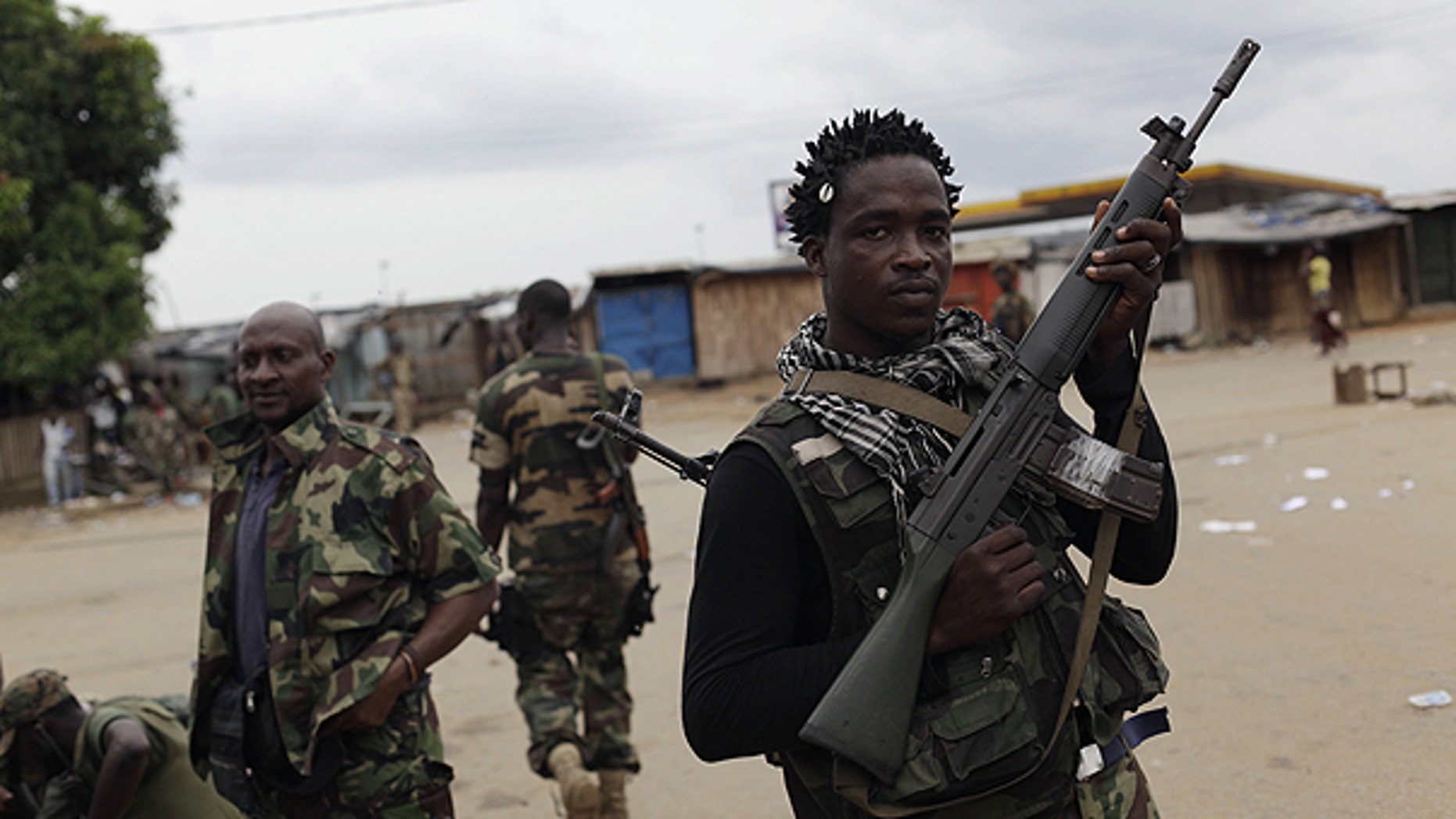 April 5: Soldiers loyal to Alassane Ouattara occupy an area of the Youpougon neighborhood, near a checkpoint at the main northern entrance to Abidjan, Ivory Coast