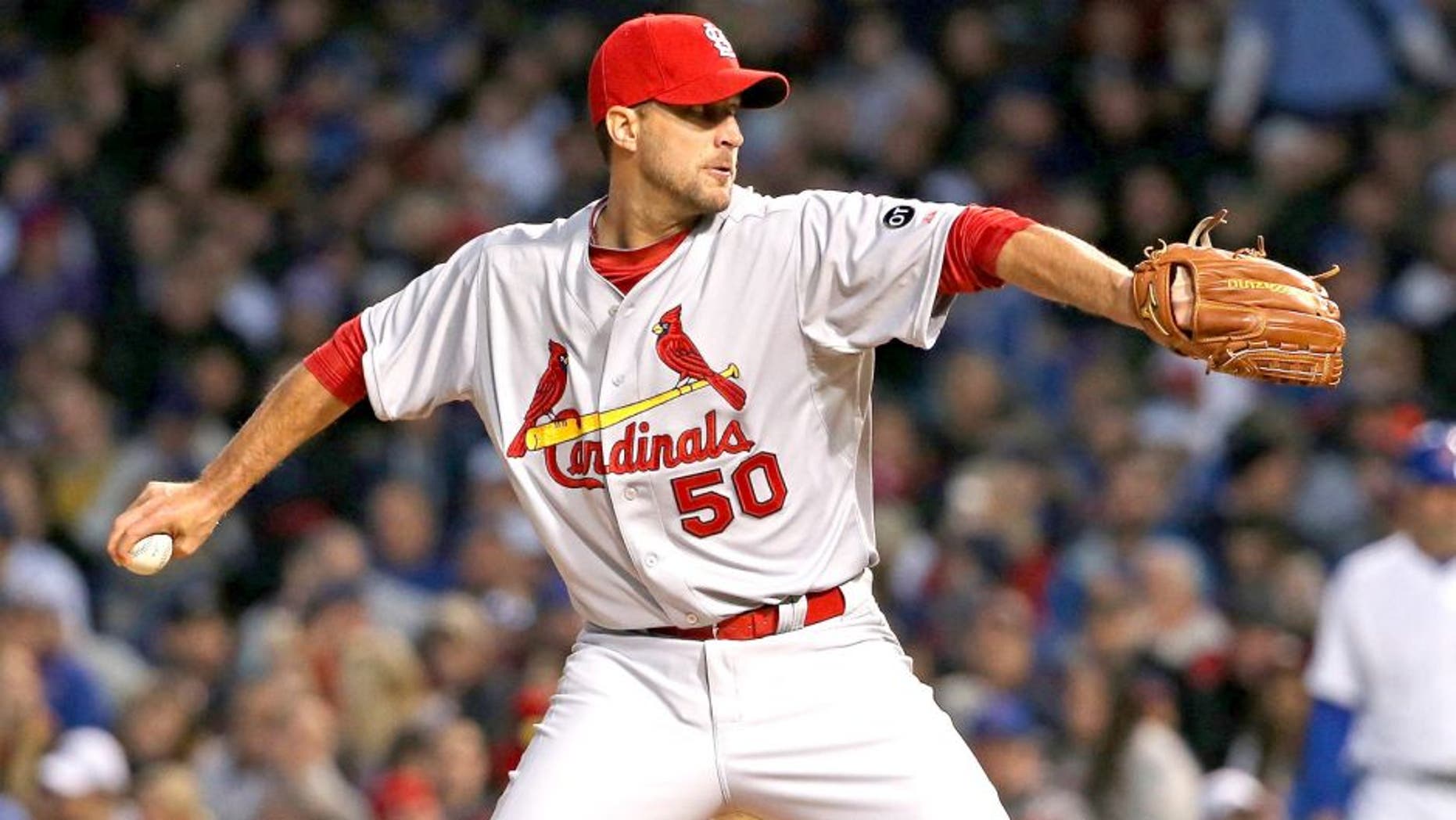 CHICAGO, IL - APRIL 05: Stating pitcher Adam Wainwright #50 of the St. Louis Cardinals delivers the ball against the Chicago Cubs during the Opening Night game at Wrigley Field on April 5, 2015 in Chicago, Illinois. (Photo by Jonathan Daniel/Getty Images)