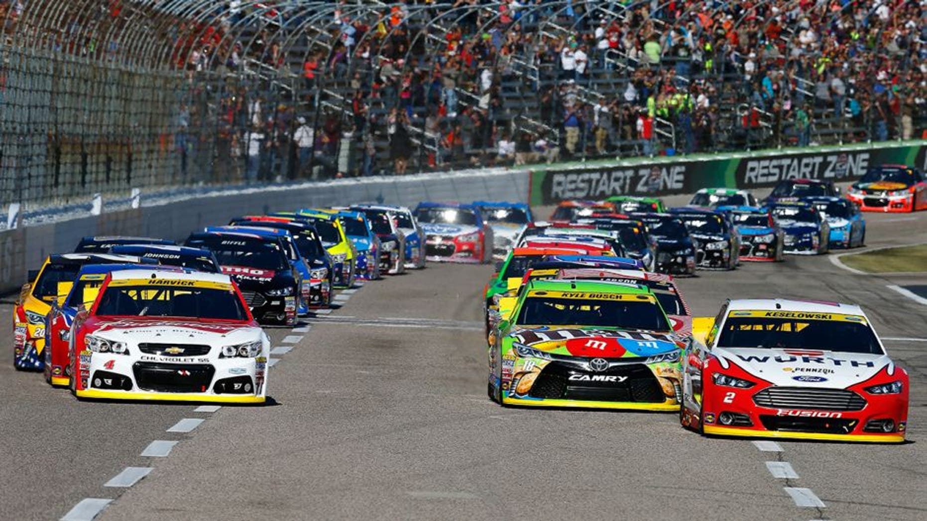 FORT WORTH, TX - NOVEMBER 08: Brad Keselowski, driver of the #2 Wurth Ford, leads the field past the green flag to start the NASCAR Sprint Cup Series AAA Texas 500 at Texas Motor Speedway on November 8, 2015 in Fort Worth, Texas. (Photo by Jonathan Ferrey/Getty Images for Texas Motor Speedway)