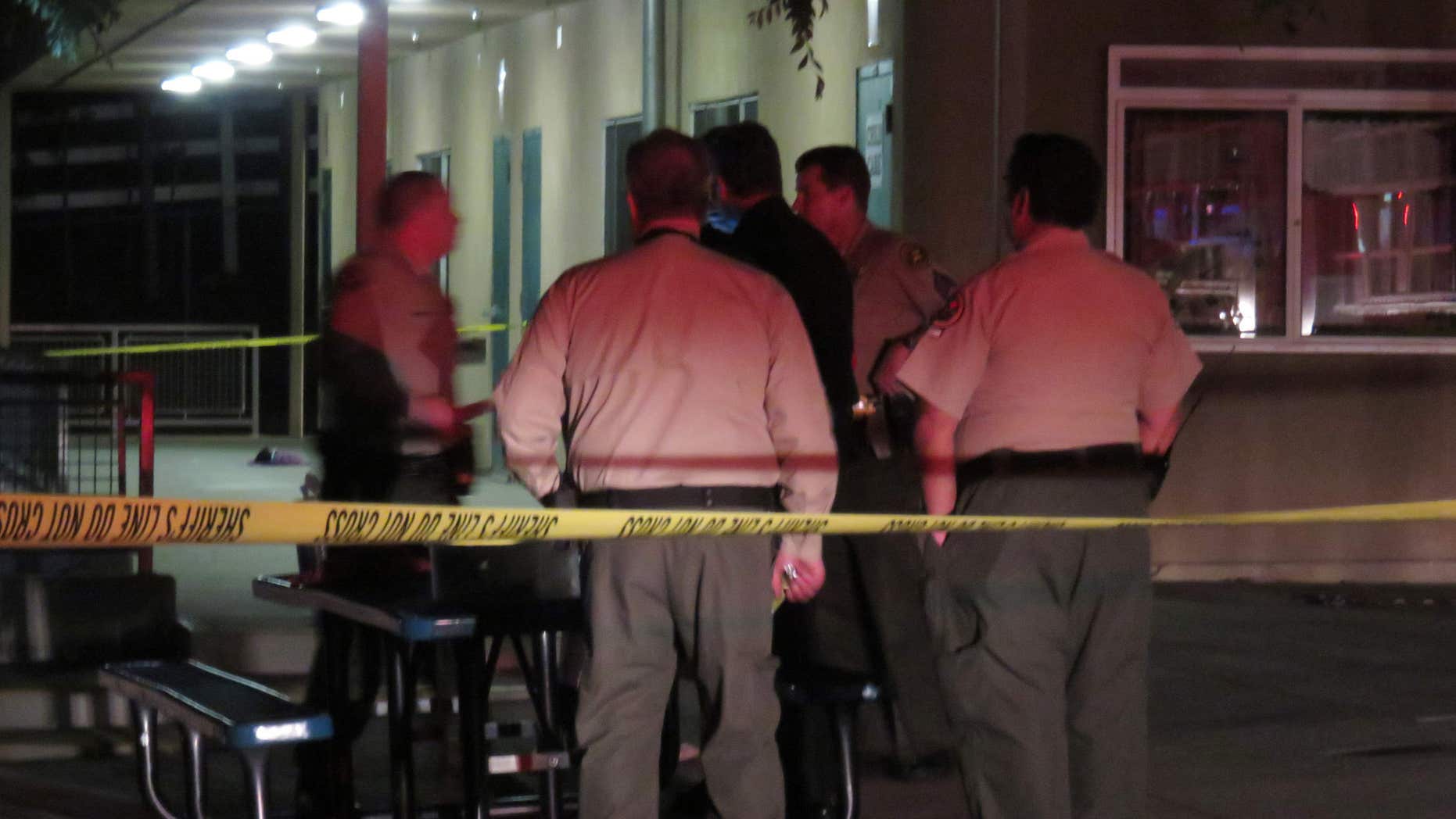 This Monday, April, 4, 2016 photo provided by Safety For Citizens shows sheriffs officials on the scene after a homemade model rocket exploded at Madrona Elementary School in Thousand Oaks, Calif.