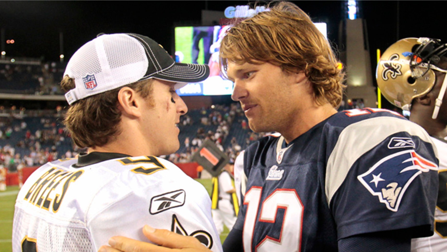 Aug. 12, 2010: New Orleans Saints quarterback Drew Brees, left, talks with New England Patriots quarterback Tom Brady after New England's 27-24 win in an NFL preseason football game in Foxborough, Mass.