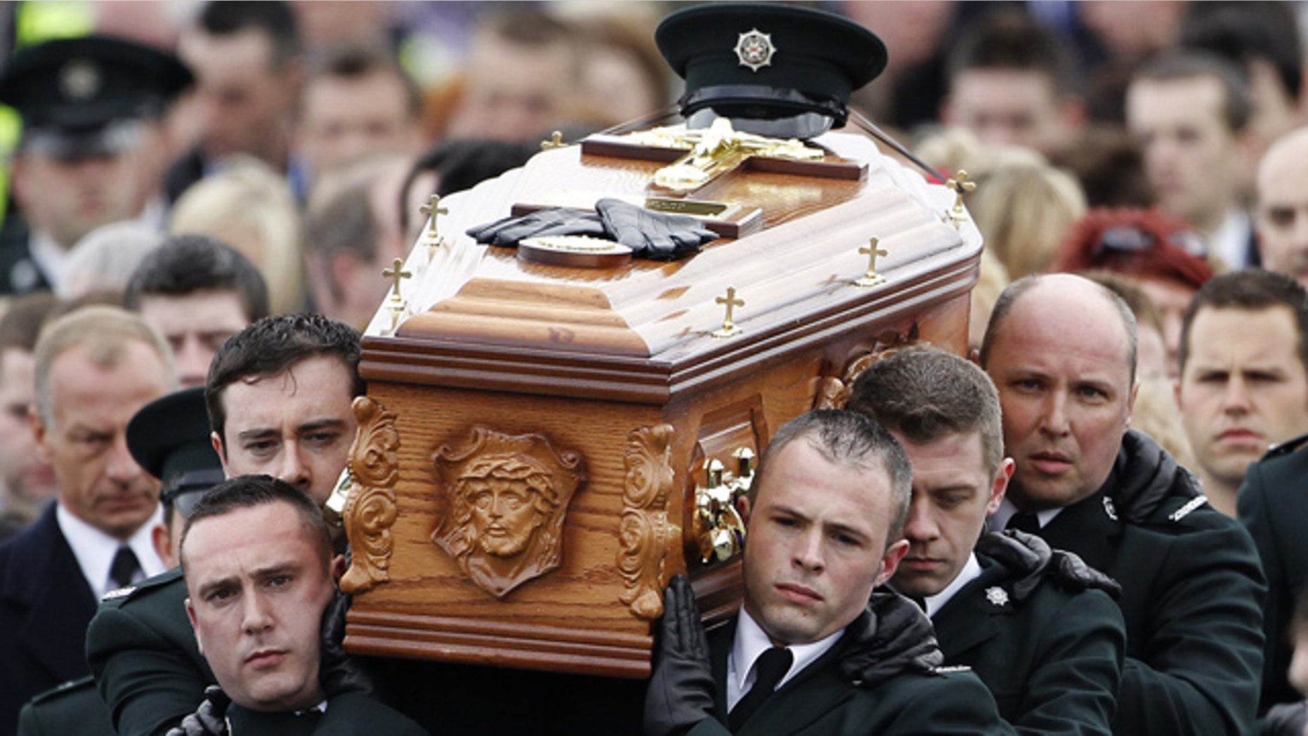 April 6: Police Service of Northern Ireland officers carry the coffin of their colleague Ronan Kerr to a funeral mass at the Church of Immaculate Conception in Beragh, Northern Ireland.