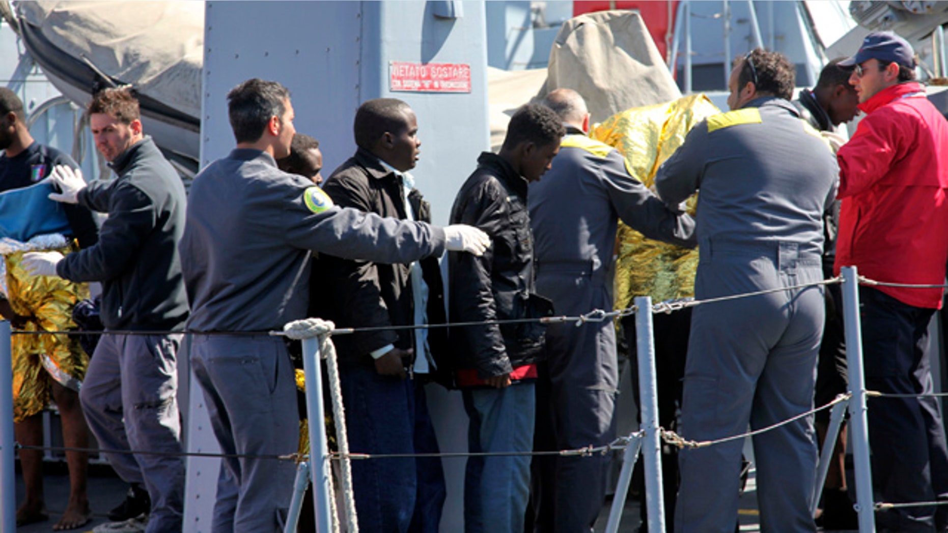 April 6: Survivors receive assistance upon their arrival in Lampedusa, southern Italy.
