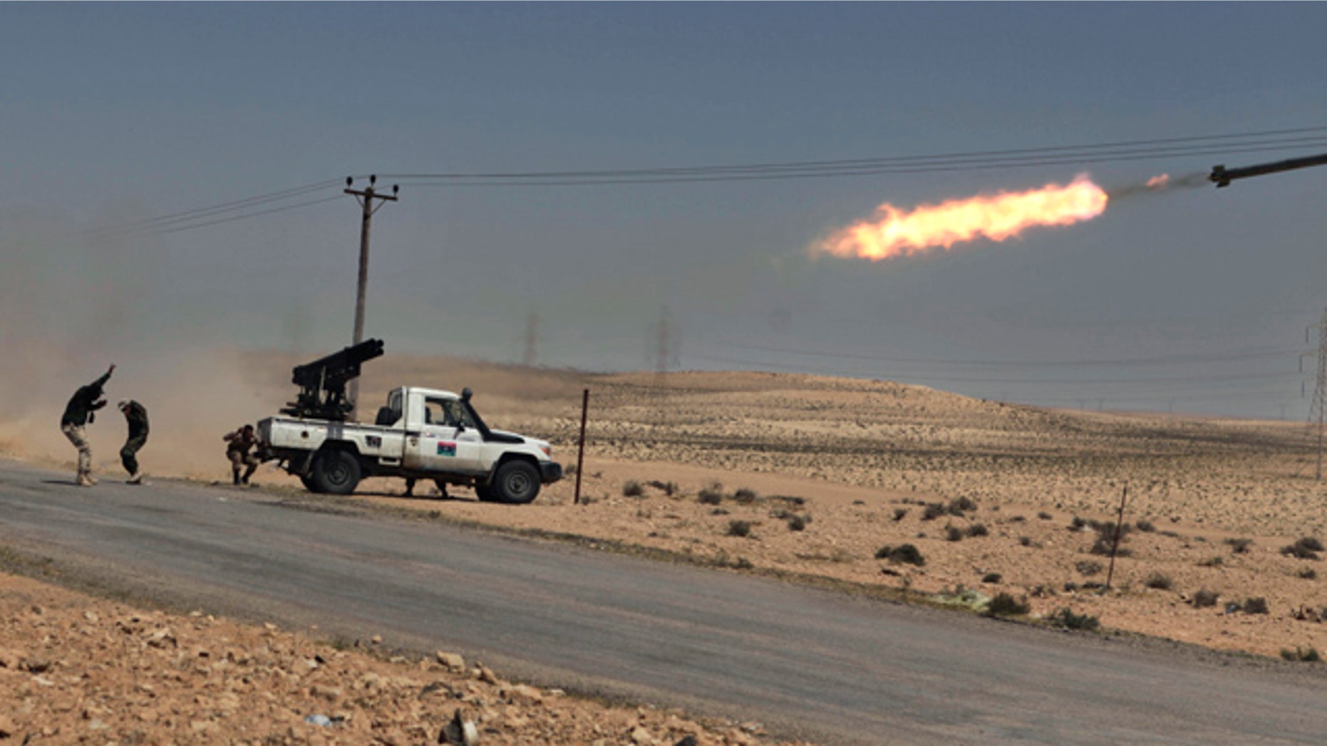 April 5: Libyan rebels shell pro Qaddafi positions just outside Brega, Libya.