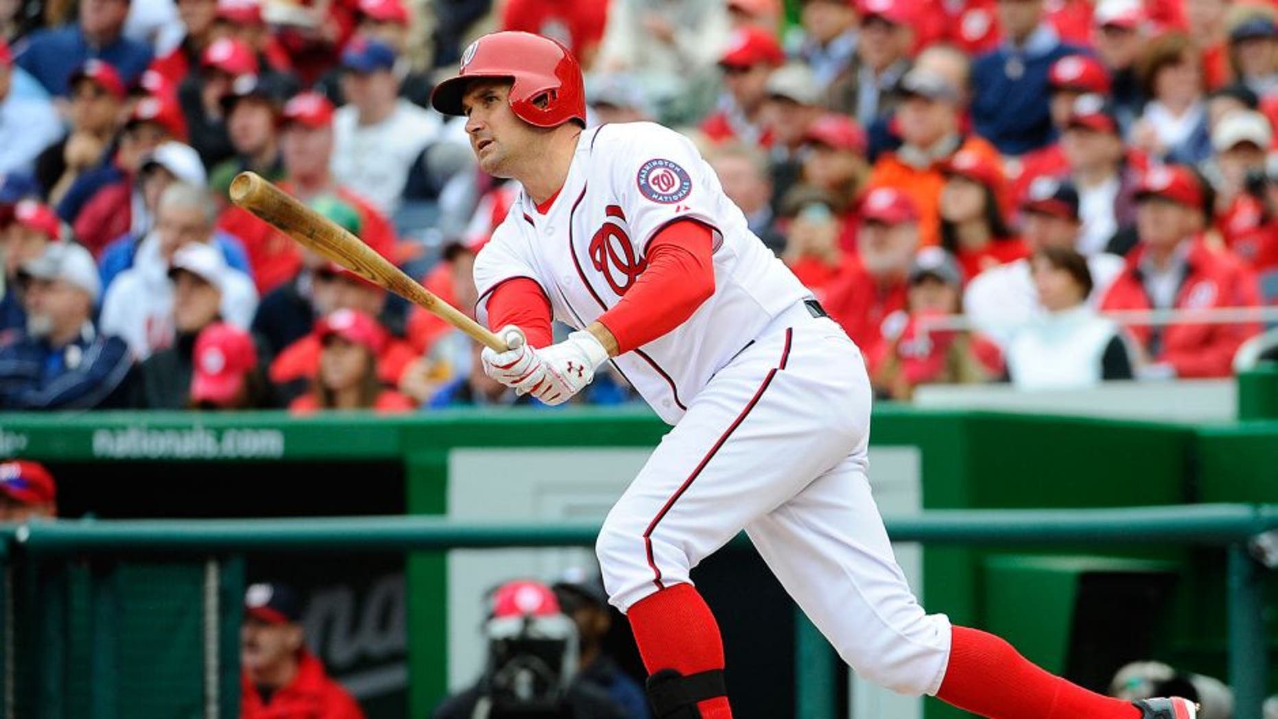 Apr 4, 2014; Washington, DC, USA; Washington Nationals third baseman Ryan Zimmerman (11) doubles against the Atlanta Braves during the fourth inning at Nationals Park. Mandatory Credit: Brad Mills-USA TODAY Sports