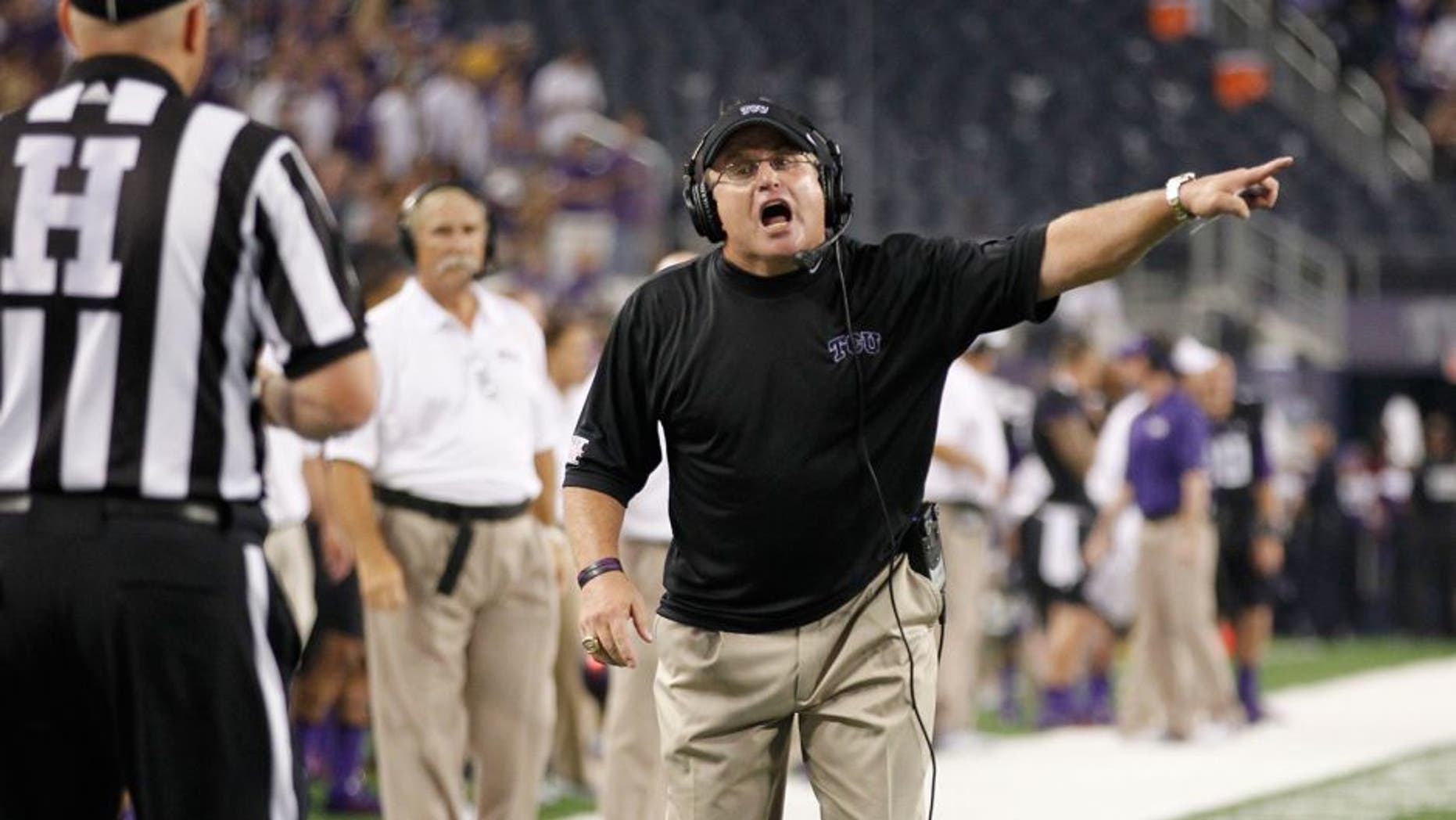 Aug 31, 2013; Arlington, TX, USA; TCU Horned Frogs head coach Gary Patterson yells at head linesman Tripp Sutter during the game against the LSU Tigers at Cowboys Stadium. LSU Tigers beat TCU Horned Frogs 37-27. Mandatory Credit: Tim Heitman-USA TODAY Sports