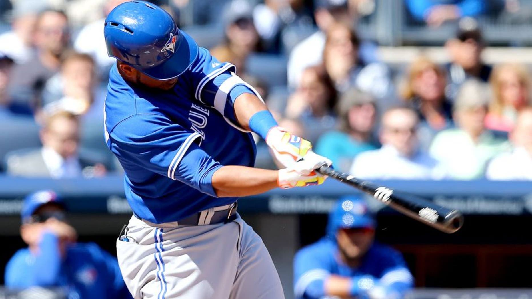 NEW YORK, NY - APRIL 06: Edwin Encarnacion #10 of the Toronto Blue Jays hits a two run homer in the third inning against the New York Yankees during Opening Day on April 6, 2015 at Yankee Stadium in the Bronx borough of New York City. (Photo by Elsa/Getty Images)