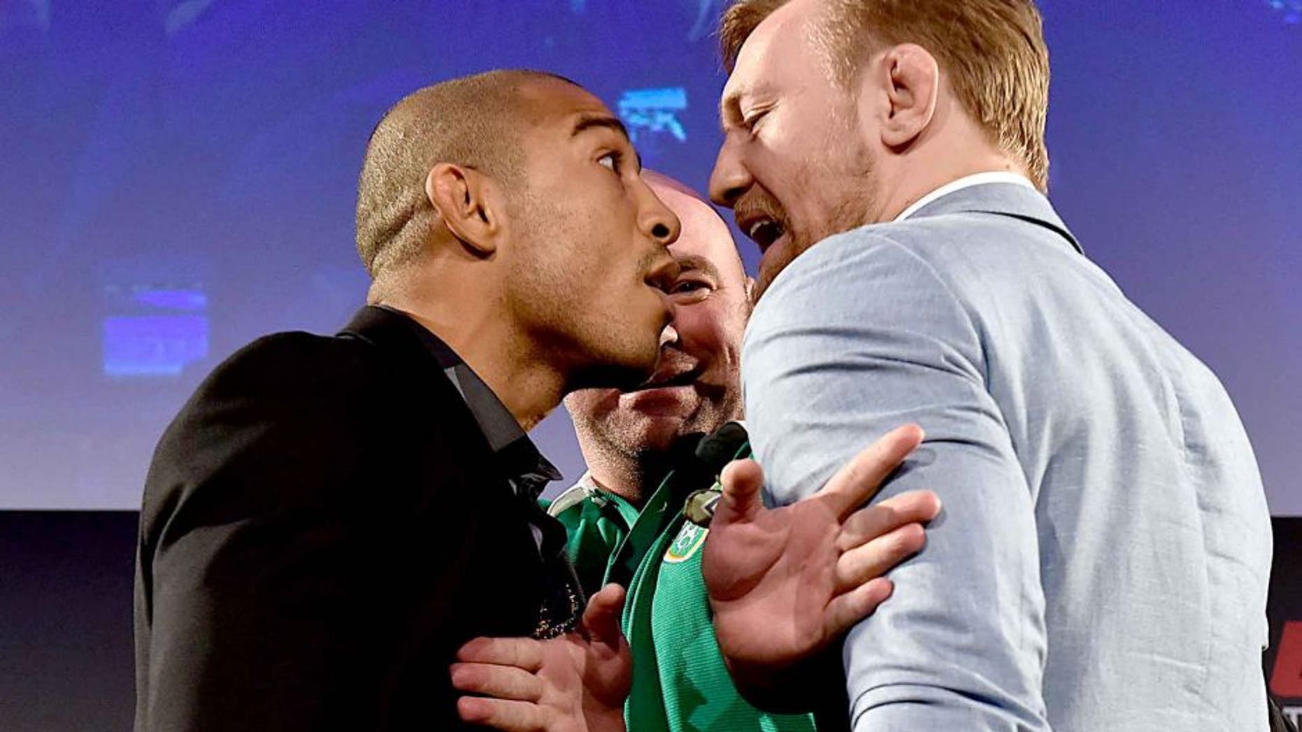 DUBLIN, IRELAND - MARCH 31: UFC President Dana White (C) separates UFC Featherweight Champion Jose Aldo of Brazil (L) and title challenger Conor 'The Notorious' McGregor of Ireland (R) as they face off during the UFC 189 World Championship Fan Event on March 31, 2015 in Dublin, Ireland. (Photo by Jeff Bottari/Zuffa LLC/Zuffa LLC via Getty Images)