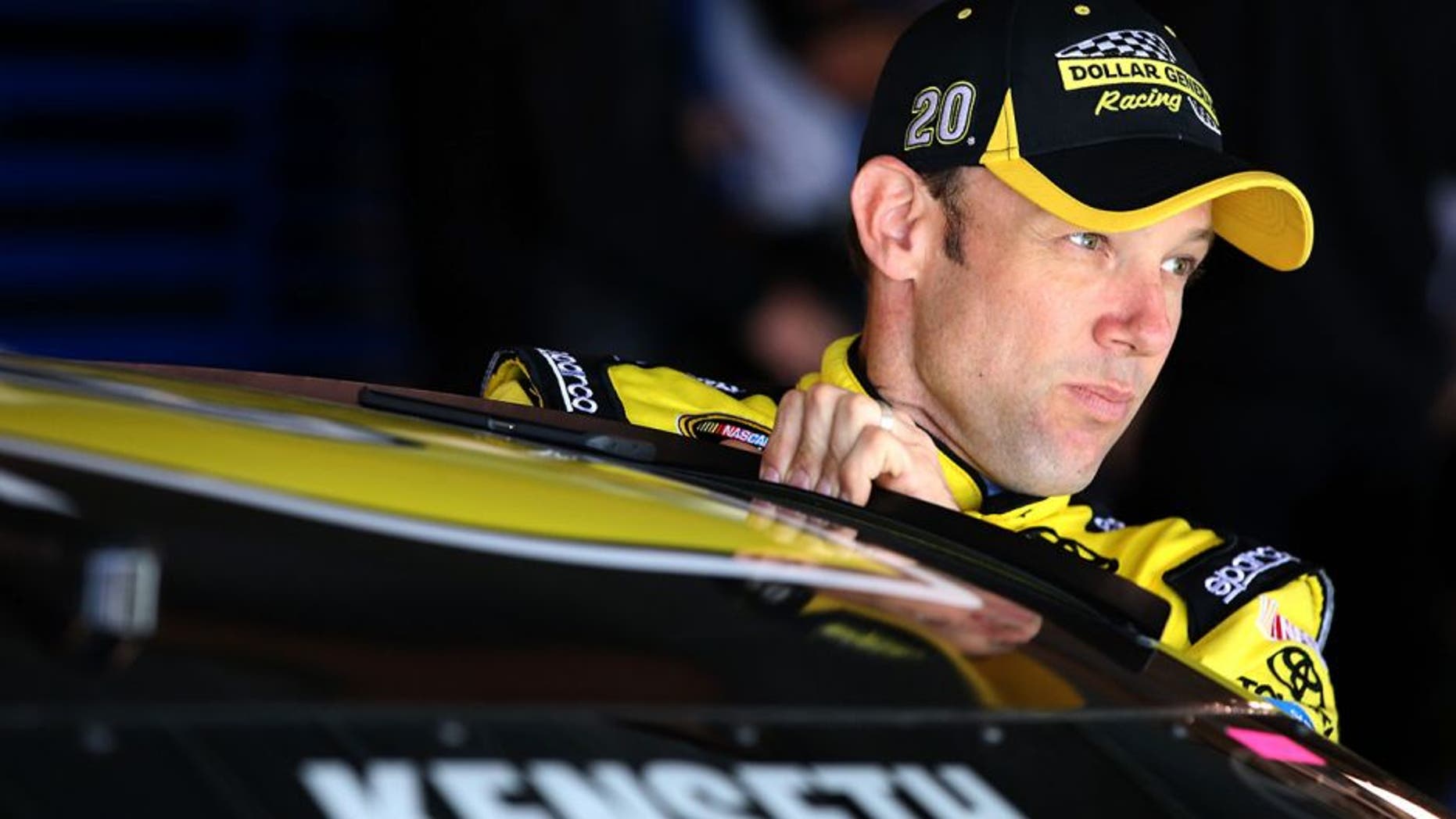 MARTINSVILLE, VA - APRIL 02: Matt Kenseth, driver of the #20 Dollar General Toyota, climbs into his car during practice for the NASCAR Sprint Cup Series STP 500 at Martinsville Speedway on April 2, 2016 in Martinsville, Virginia. (Photo by Sean Gardner/NASCAR via Getty Images)