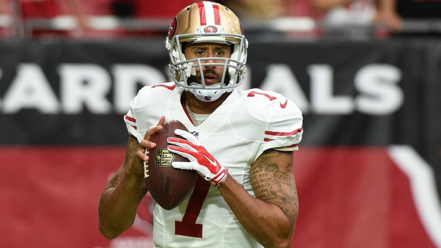 against the San Francisco 49ers at University of Phoenix Stadium on September 27, 2015 in Glendale, Arizona.,GLENDALE, AZ - SEPTEMBER 27: Colin Kaepernick #7 of the San Francisco 49ers prepares for a game against the Arizona Cardinals at University of Phoenix Stadium on September 27, 2015 in Glendale, Arizona. (Photo by Norm Hall/Getty Images)