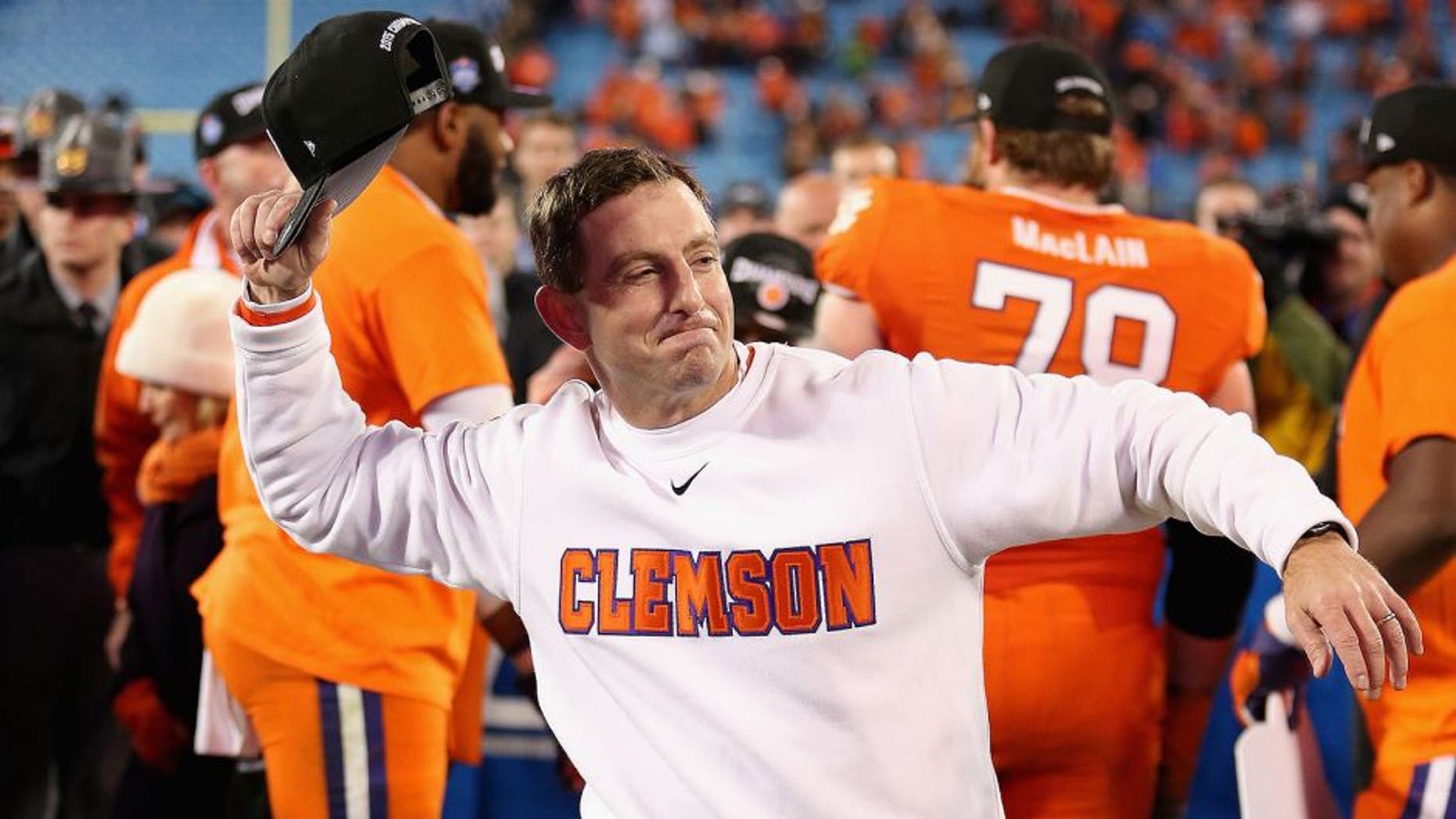 CHARLOTTE, NC - DECEMBER 05: Head coach Dabo Swinney of the Clemson Tigers celebrates after defeating the North Carolina Tar Heels 45-37 at the Atlantic Coast Conference Football Championship at Bank of America Stadium on December 5, 2015 in Charlotte, North Carolina. (Photo by Streeter Lecka/Getty Images)