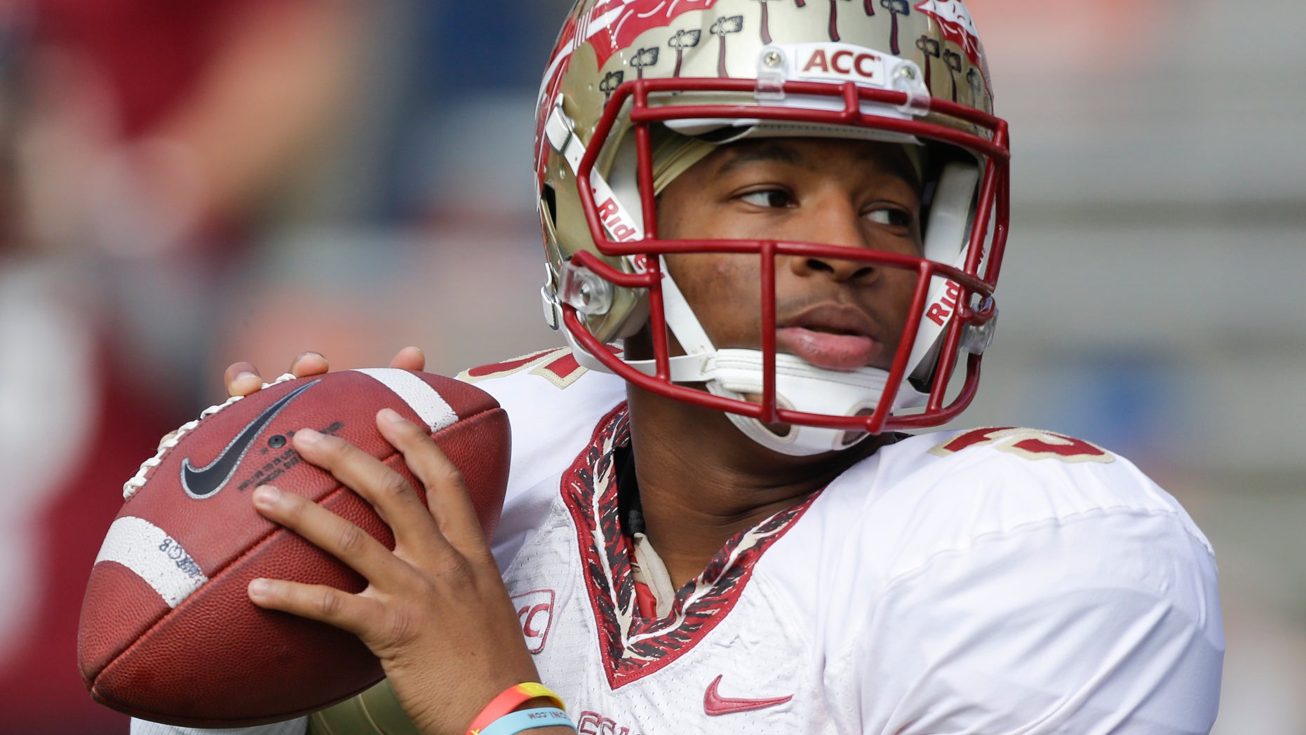 FILE - In this Nov. 30, 2013, file photo, Florida State quarterback Jameis Winston warms up before an NCAA college football game against Florida in Gainesville, Fla. The prosecutor overseeing the investigation of sexual assault allegations against Winston says it is completed. State Attorney Willie Meggs has scheduled a news conference at 2 p.m. Thursday, Dec. 5, 2013, in his office to announce his findings. (AP Photo/John Raoux, File)