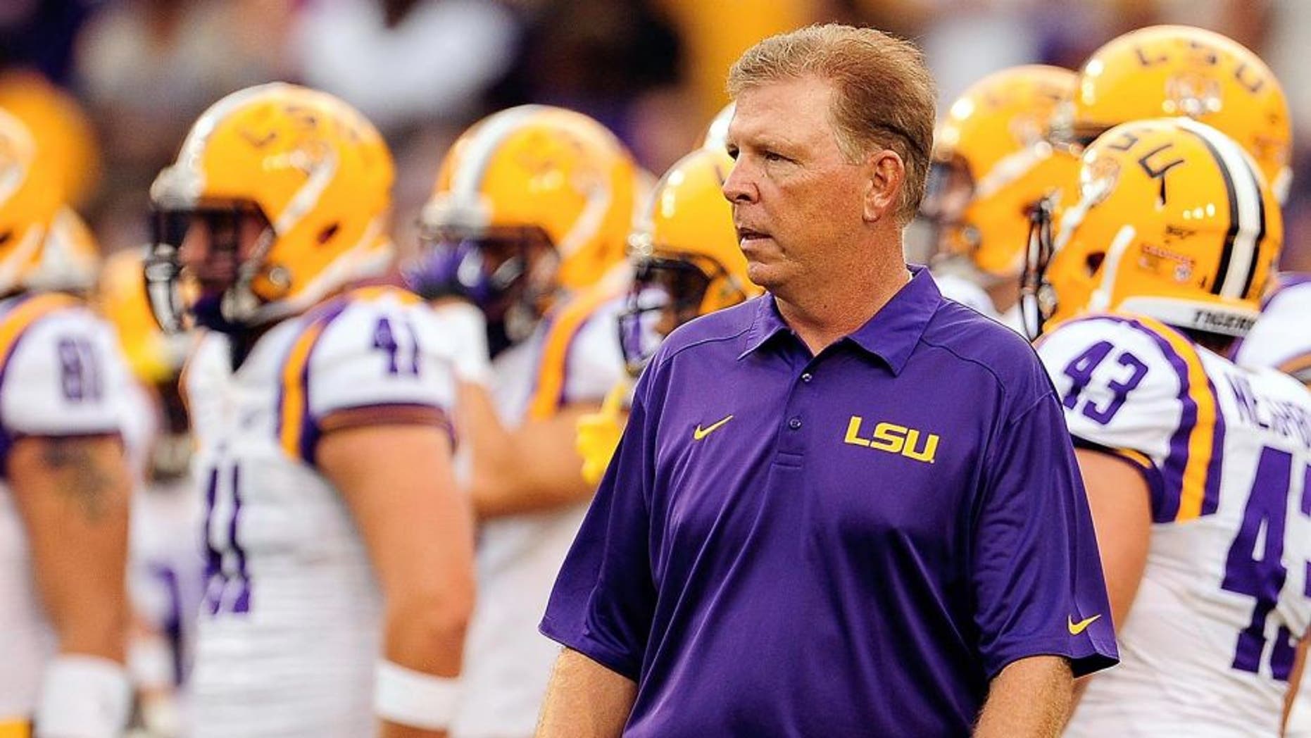 BATON ROUGE, LA - SEPTEMBER 07: Cam Cameron, offensive coordinator of the LSU Tigers, watches his team during warmups prior to a game at Tiger Stadium against the UAB Blazers on September 7, 2013 in Baton Rouge, Louisiana. LSU won the game 56-17. (Photo by Stacy Revere/Getty Images)