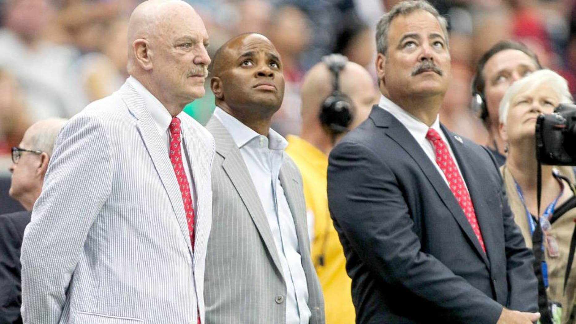 Aug 16, 2014; Houston, TX, USA; Houston Texans owner Bob McNair (left) and general manager Rick Smith (middle) and chief operating officer Cal McNair (right) watch during the first quarter against the Atlanta Falcons at NRG Stadium. Mandatory Credit: Troy Taormina-USA TODAY Sports