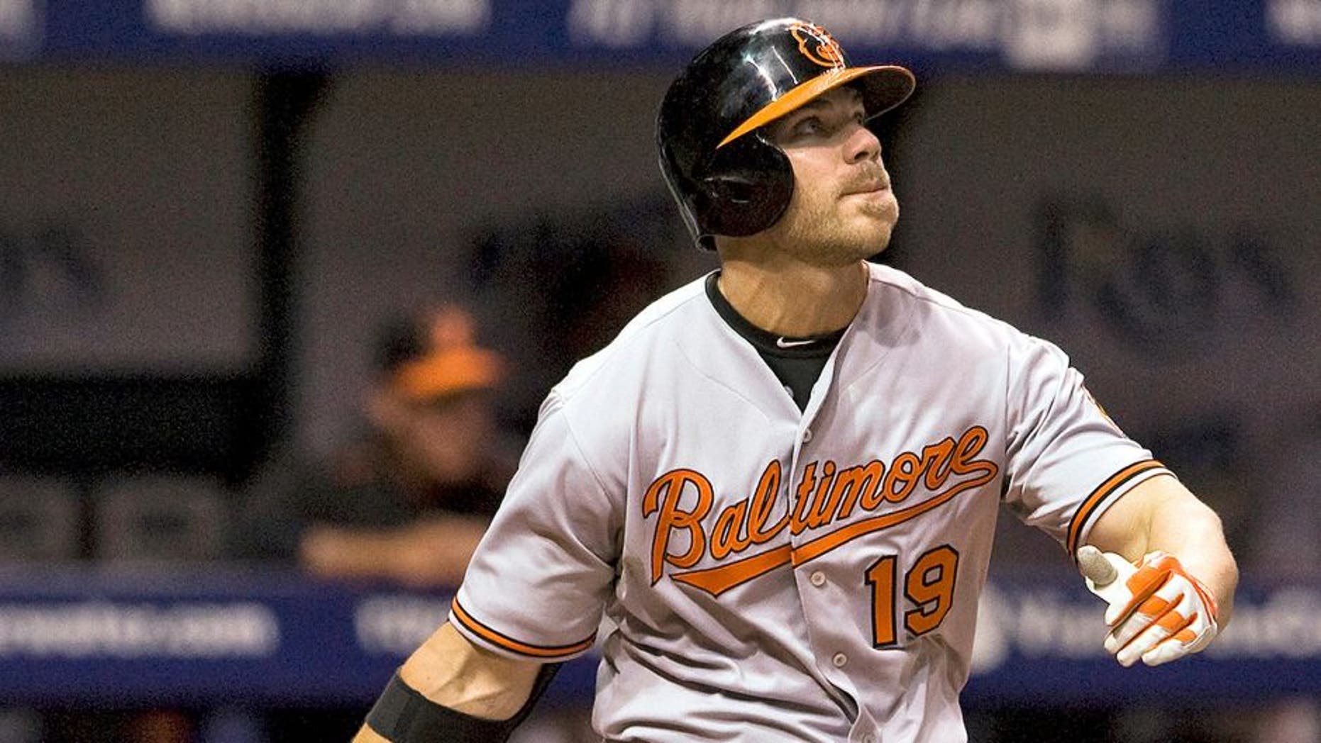Baltimore Orioles designated hitter Chris Davis flies out to right field during the eighth inning of a baseball game against the Tampa Bay Rays, Tuesday, April 7, 2015, in St. Petersburg, Fla. Davis was hitless in his first game since he was reinstated from the restricted list earlier Tuesday. Davis was suspended 25 games by MLB on Sept. 12 for testing positive for an amphetamine. (AP Photo/Steve Nesius)