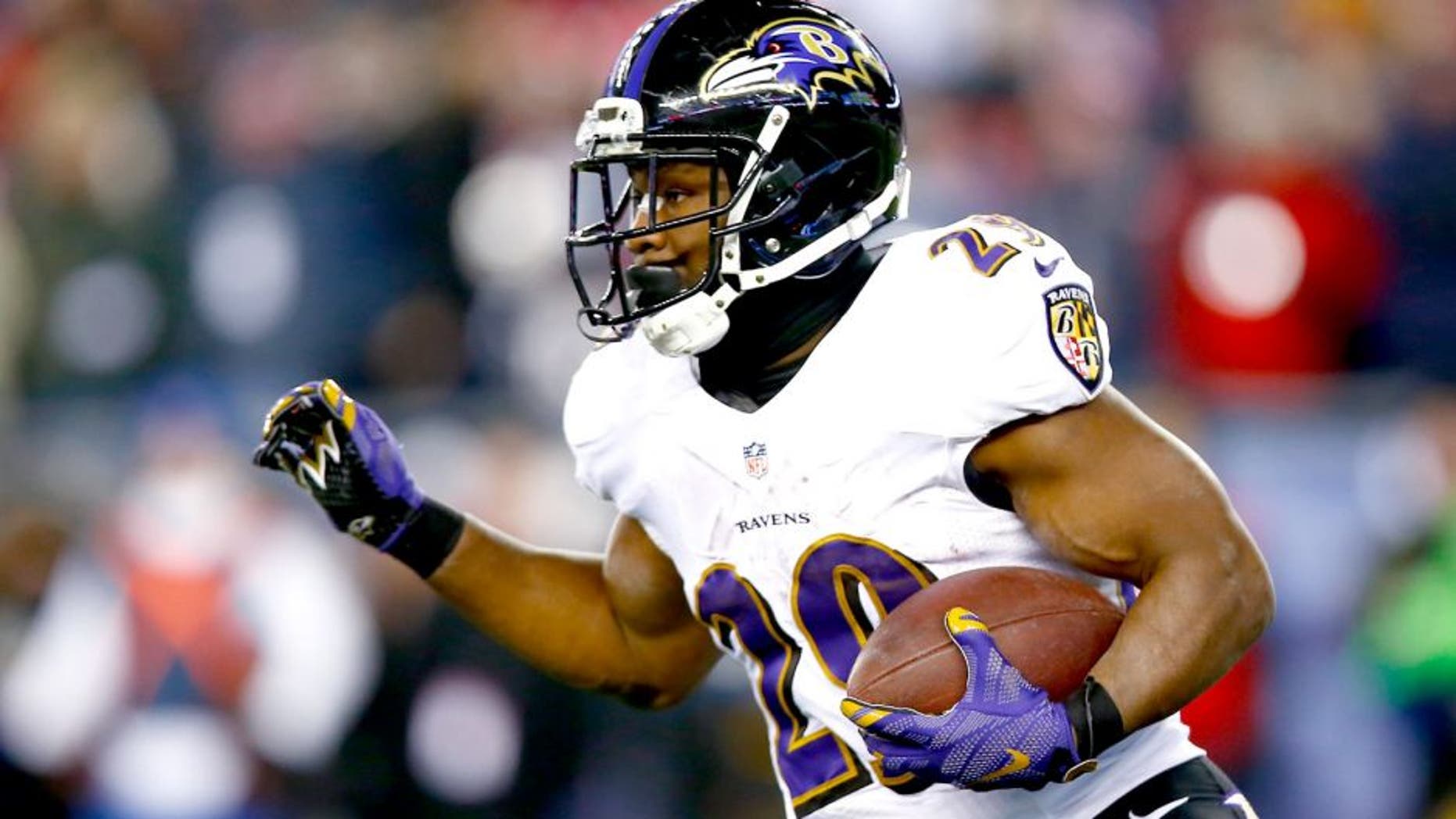 FOXBORO, MA - JANUARY 10: Justin Forsett #29 of the Baltimore Ravens carries the ball during the second half of the 2015 AFC Divisional Playoffs game against the New England Patriots at Gillette Stadium on January 10, 2015 in Foxboro, Massachusetts. (Photo by Jared Wickerham/Getty Images)